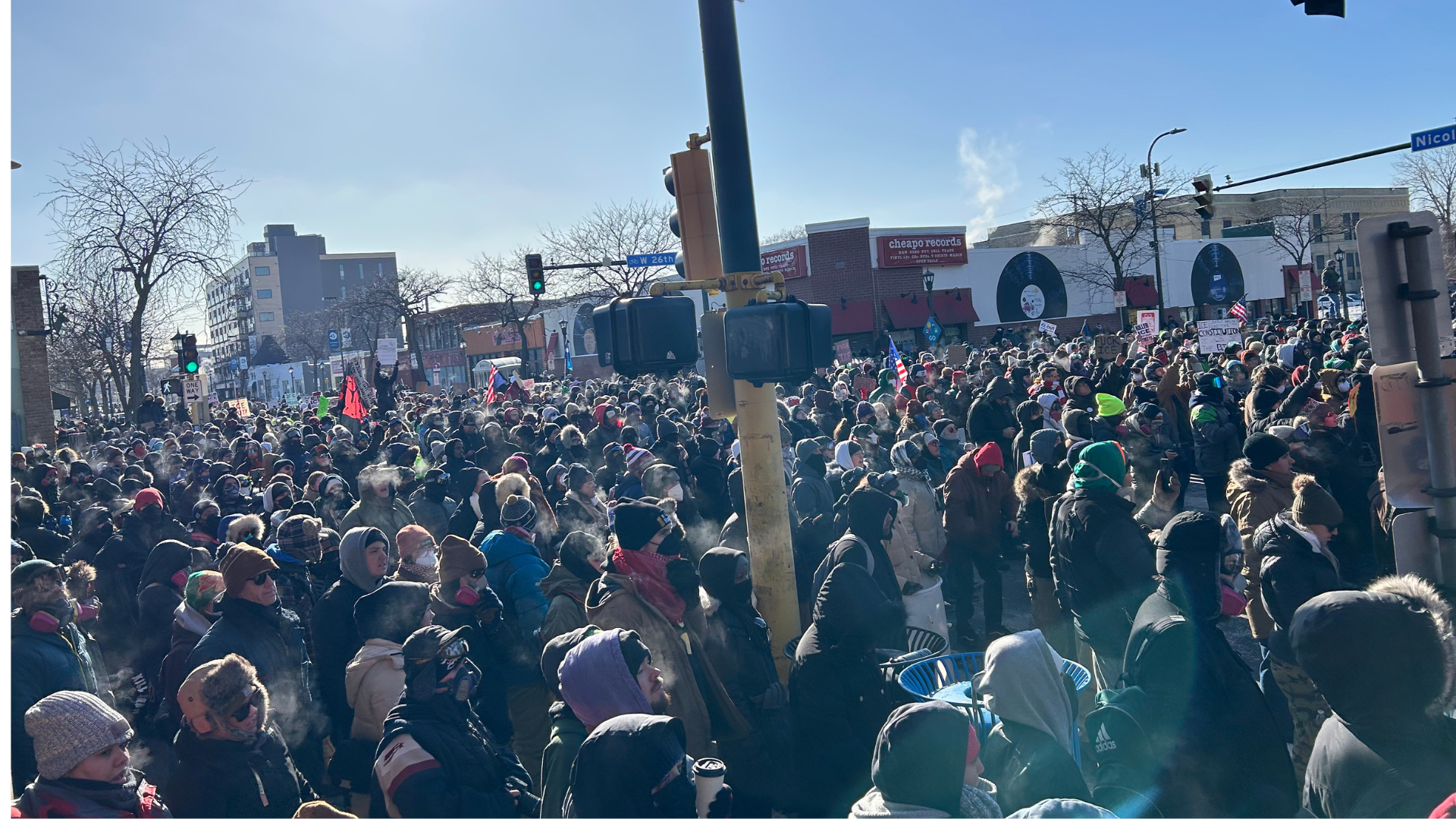 Protesters congregate at the corner near where Alex Pretti was shot and killed on January 24, 2026.