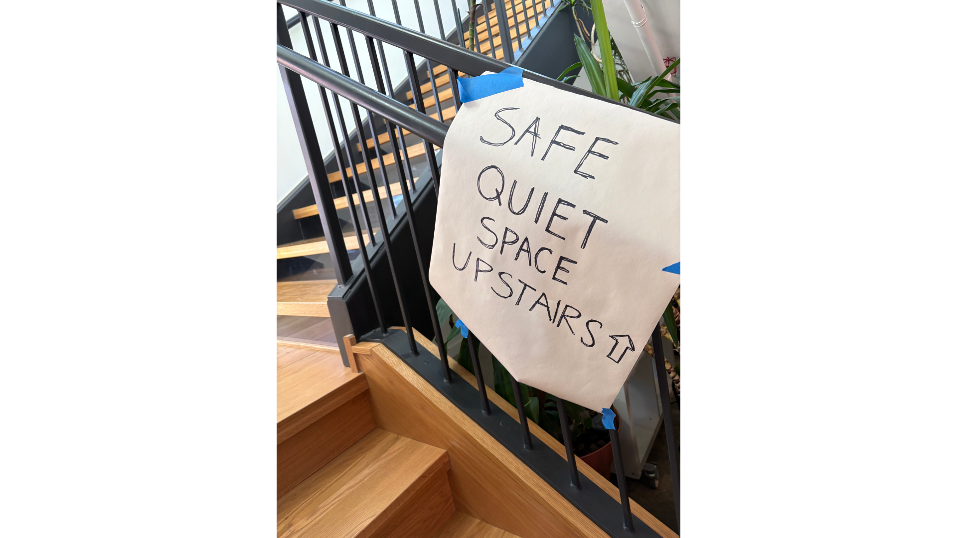 A makeshift sign in a yoga studio indicating a place offering something different than the cold and the crowds outside.