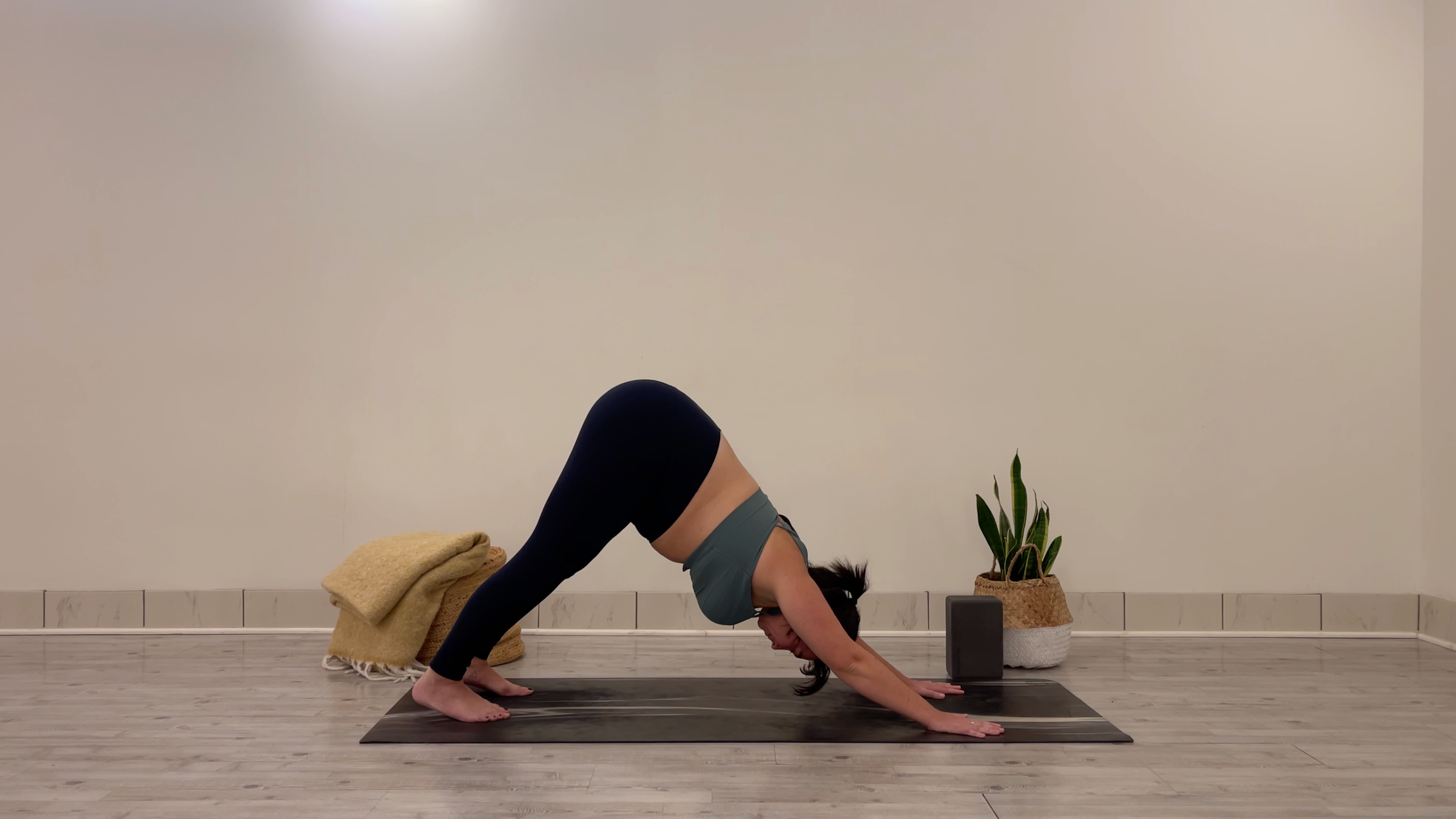 Teacher Taylor Lorenz in Downward-Facing Dog