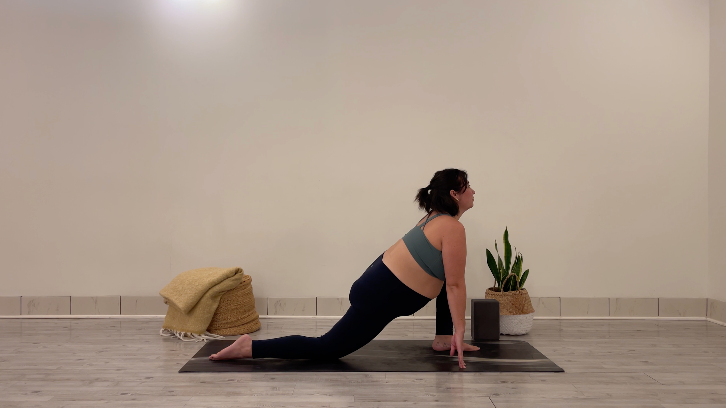 oga teacher Taylor Lorenz in Low Lunge, part of her morning yoga practice