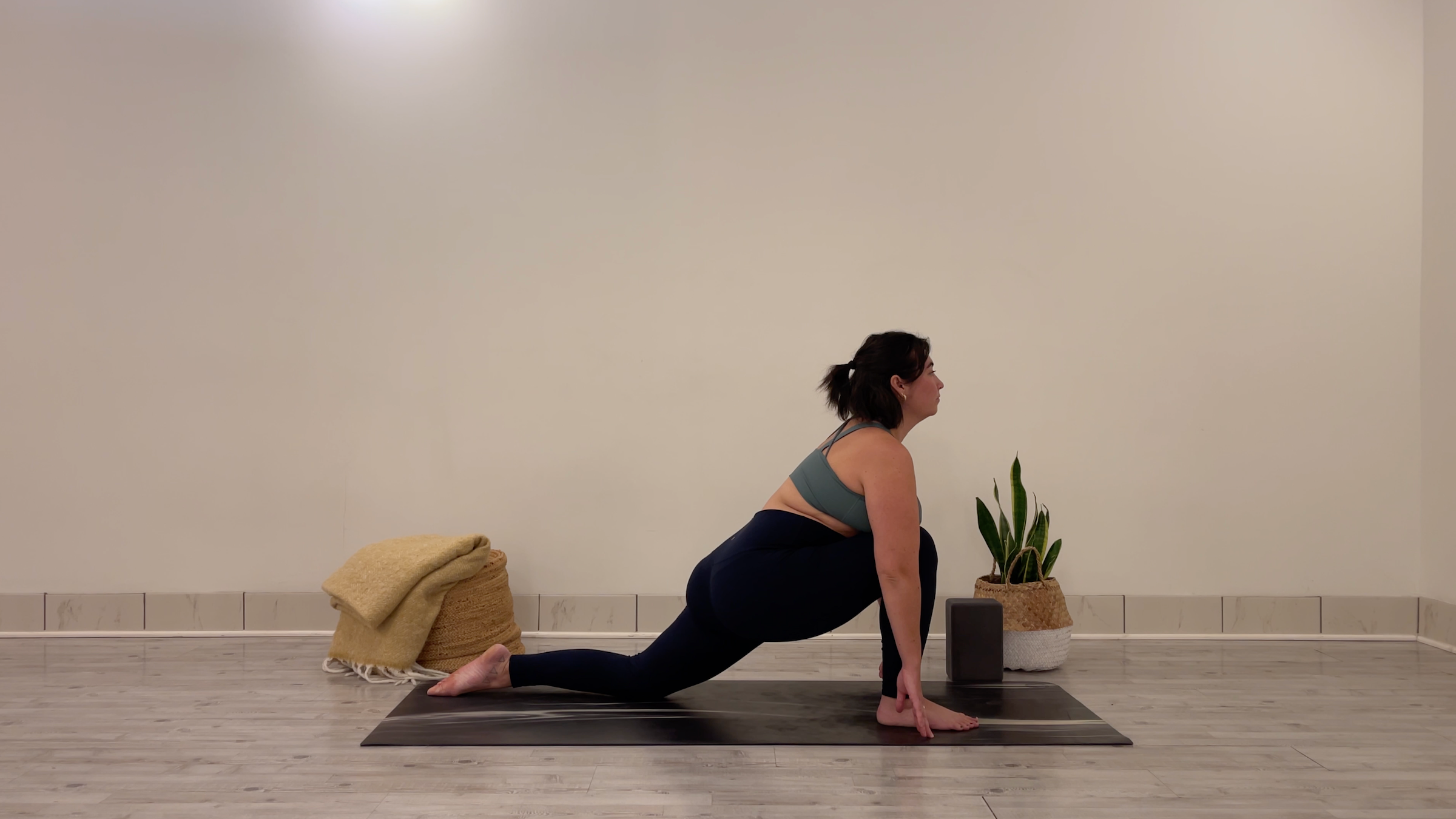 Yoga teacher Taylor Lorenz in Low Lunge, part of her morning yoga practice