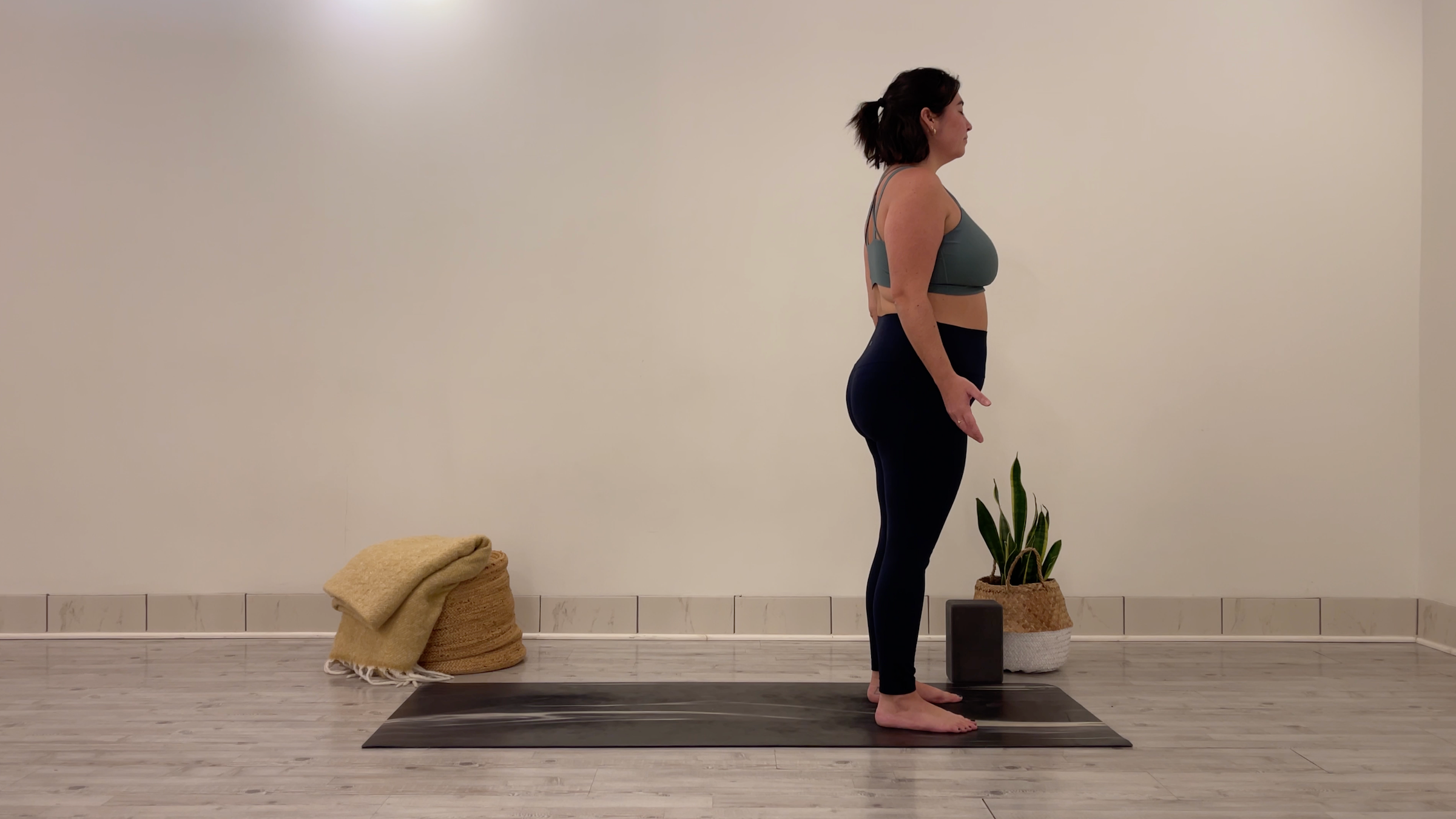Yoga teacher Taylor Lorenz in Mountain Pose, part of her morning yoga practice