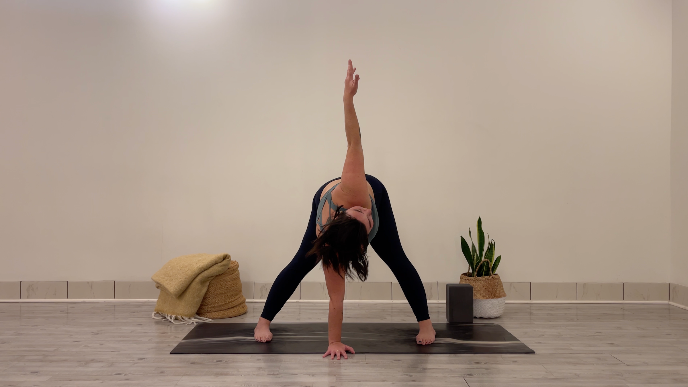 Teacher Taylor Lorenz in Twisting Wide-Legged Forward Bend