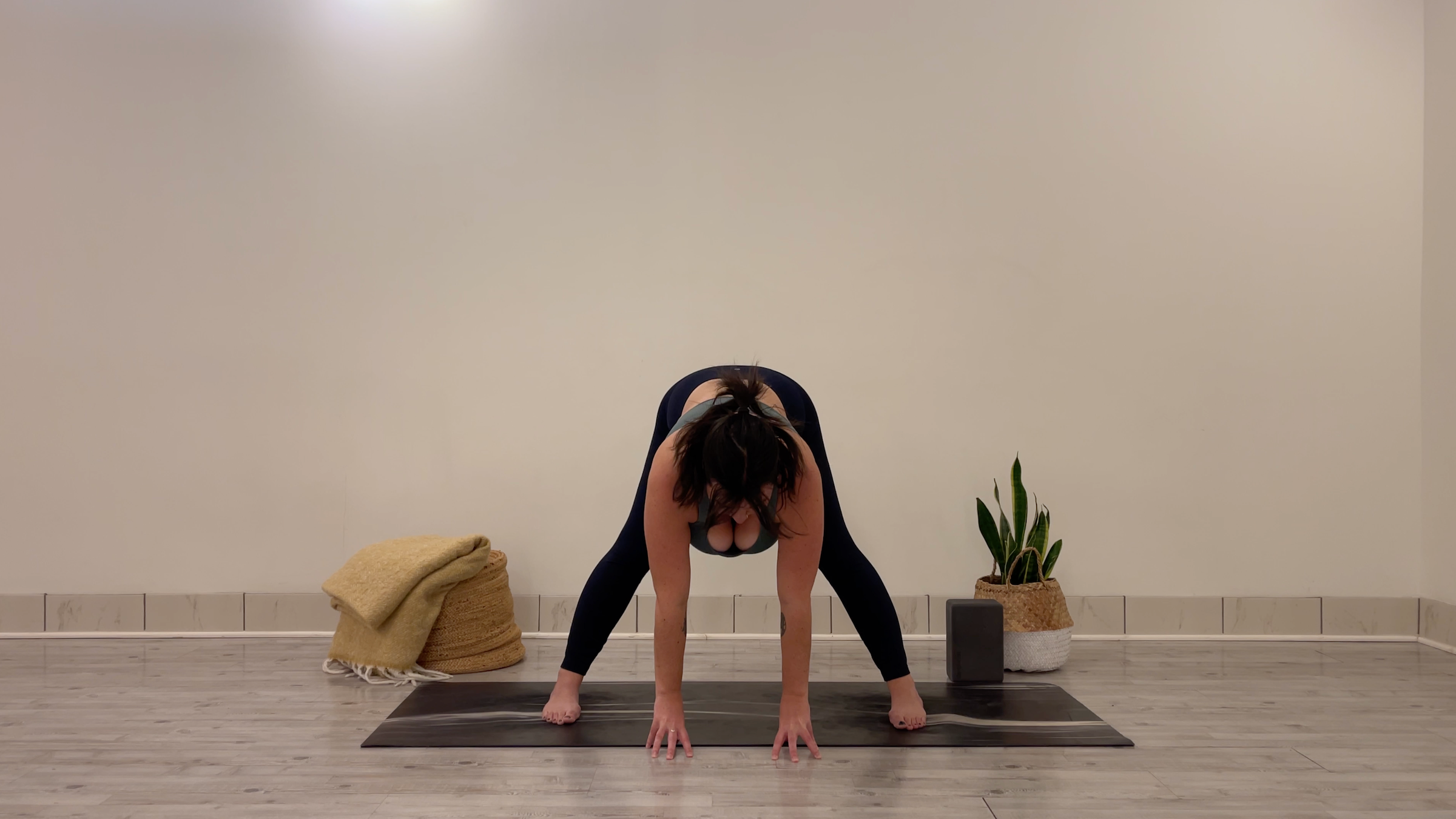 Yoga teacher Taylor Lorenz in Wide-Legged Halfway Lift, part of her morning yoga practice
