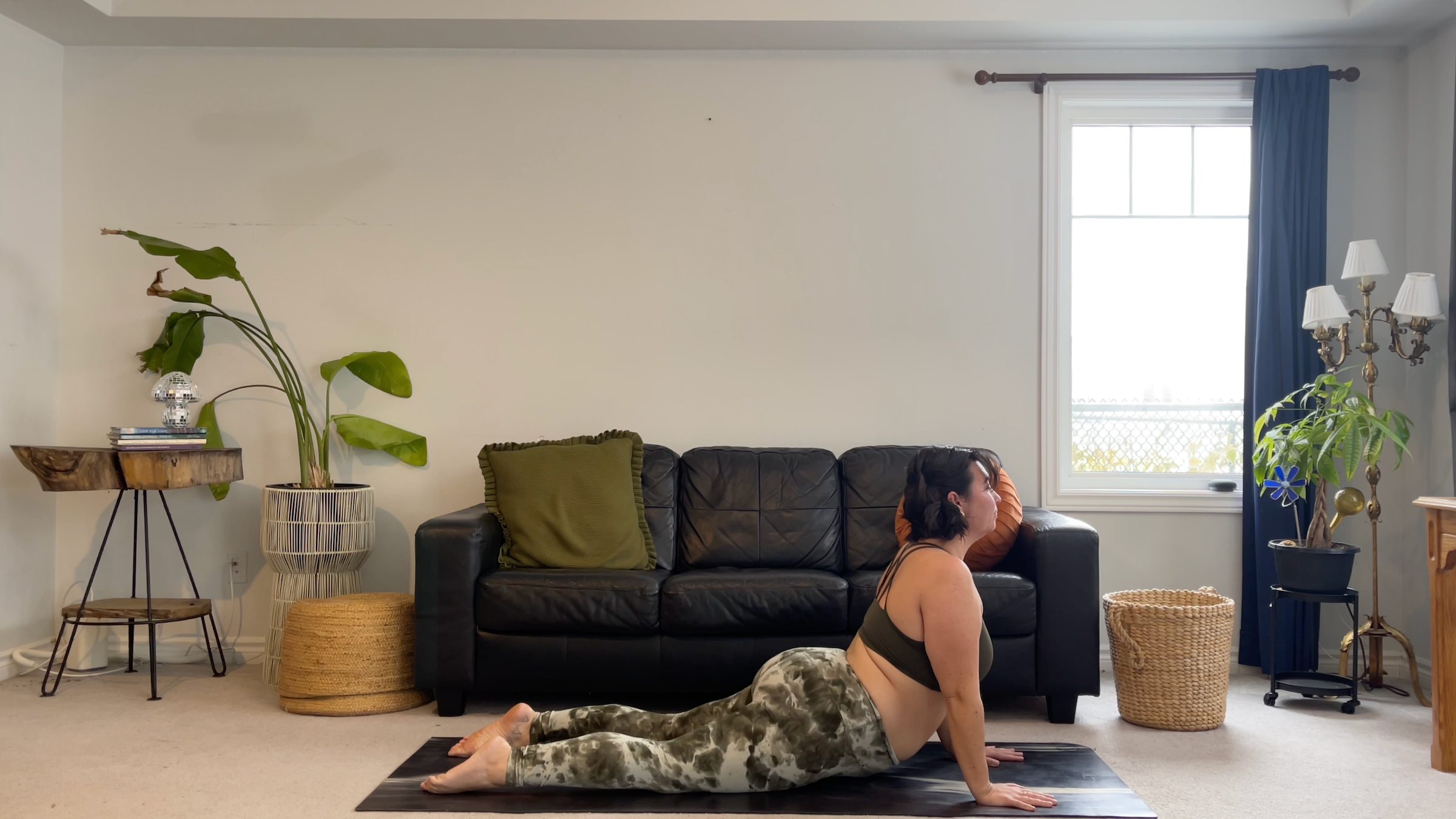 Yoga teacher Taylor Lorenz in Cobra Pose, part of her new moon yoga practice
