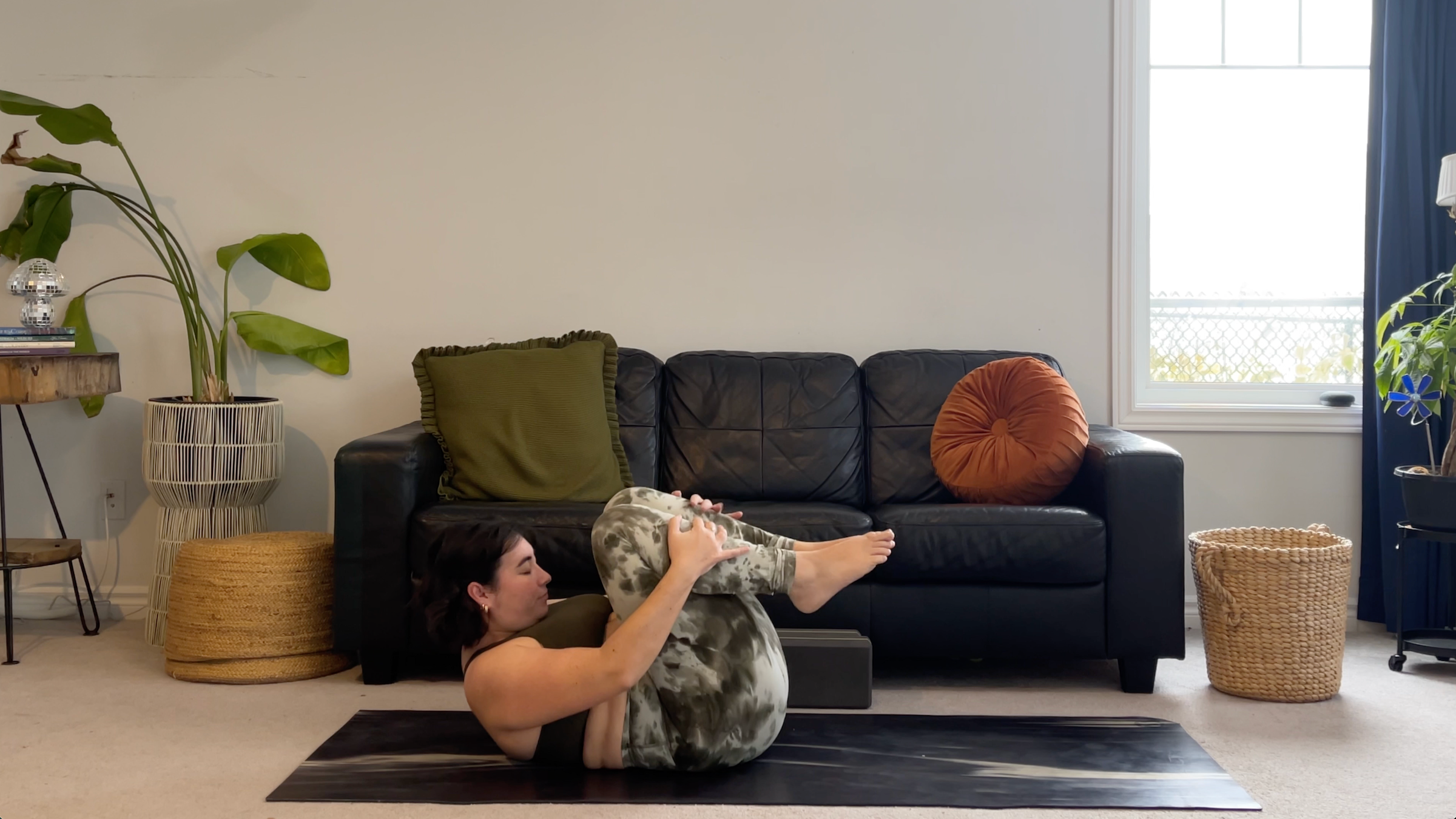 Yoga teacher Taylor Lorenz in Dynamic Pencil Stretch, part of her new moon yoga practice