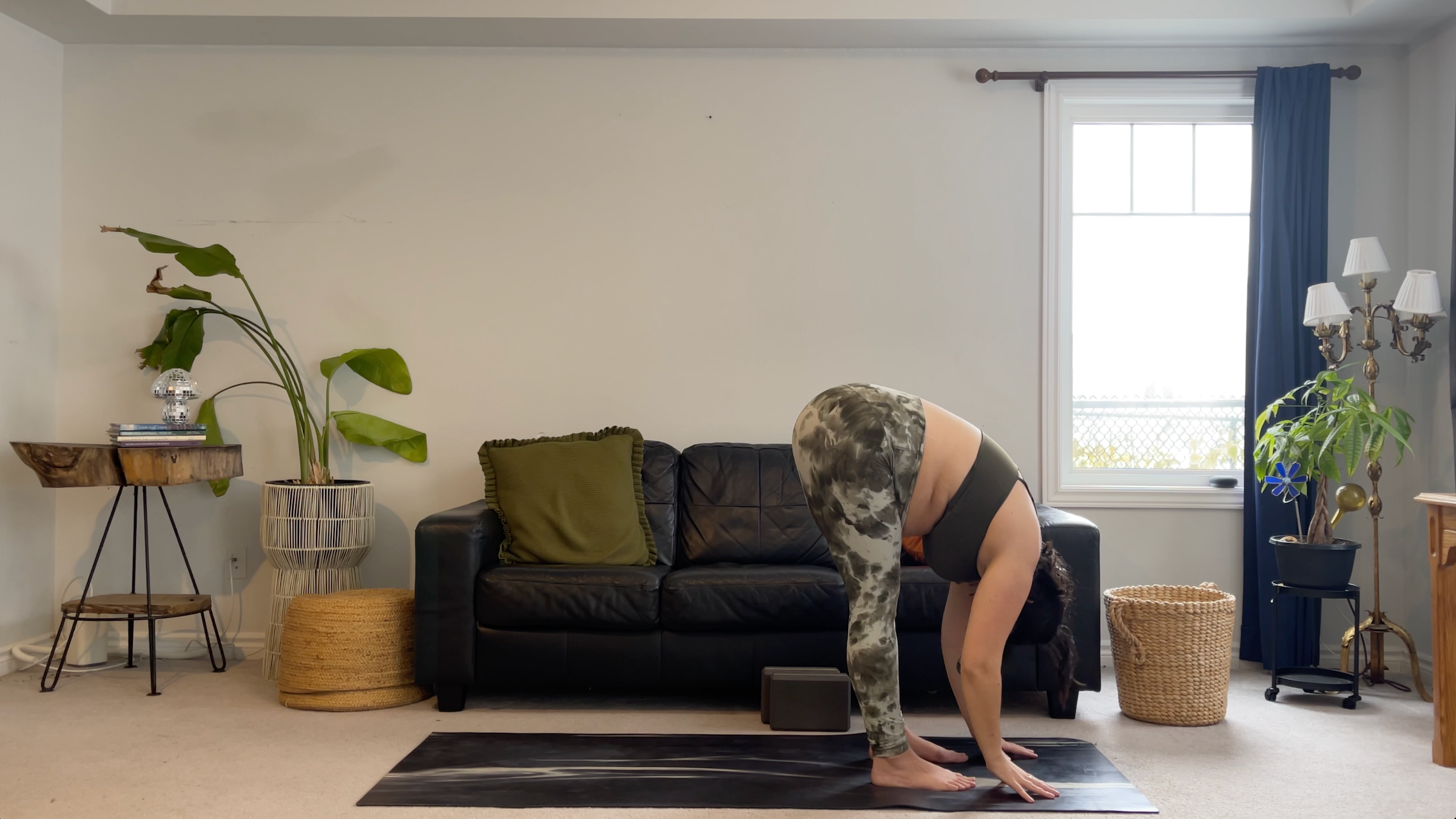 Teacher Taylor Lorenz in Standing Forward Bend