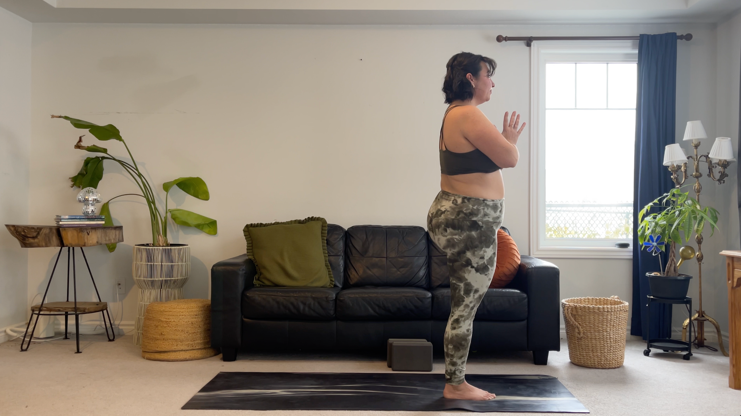 Yoga teacher Taylor Lorenz in Tree Pose, part of her new moon yoga practice