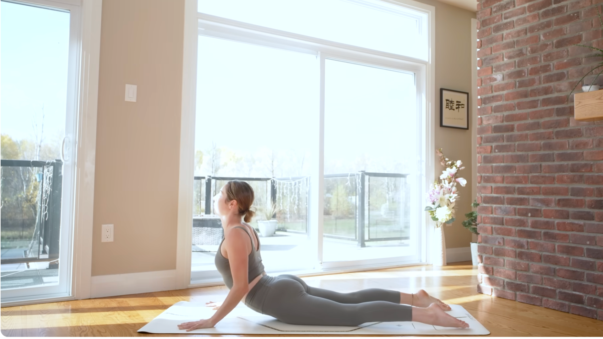 Woman practicing Cobra Pose during a power yoga for energy sequence