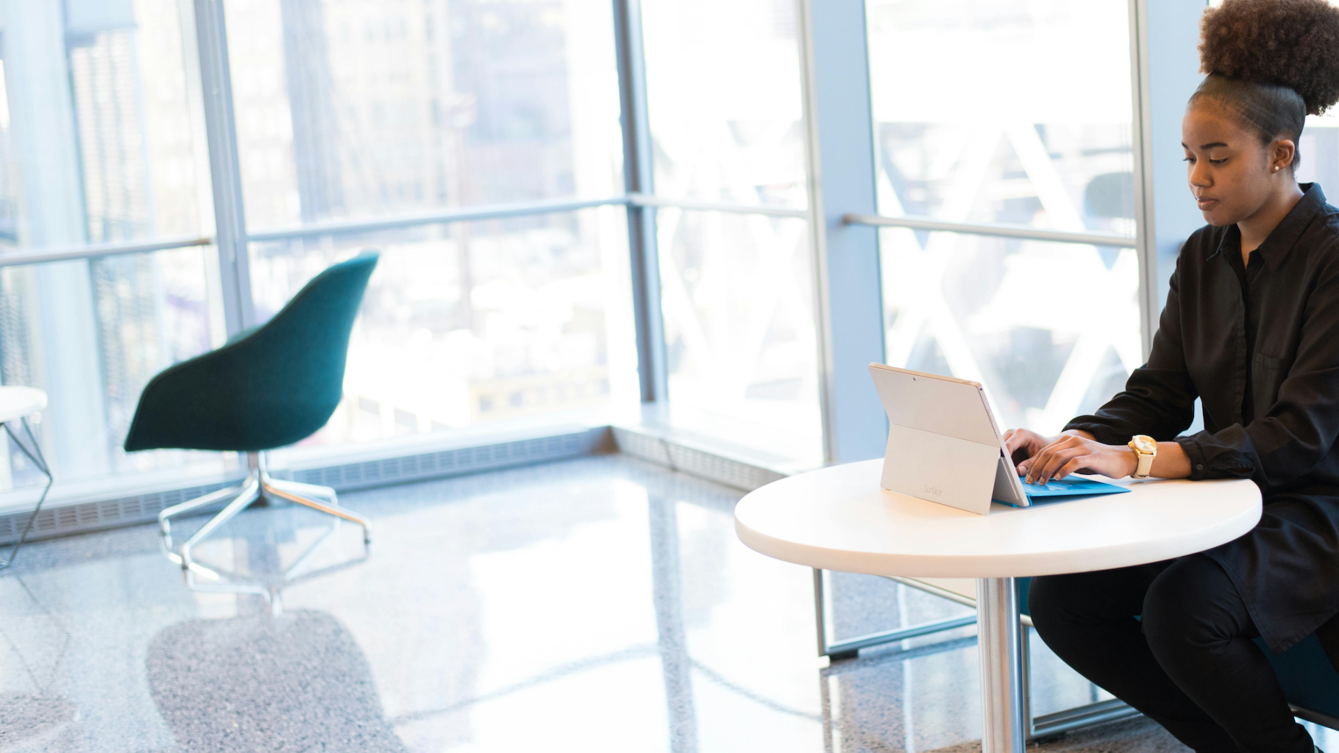 Woman sitting at a desk and working on a laptop