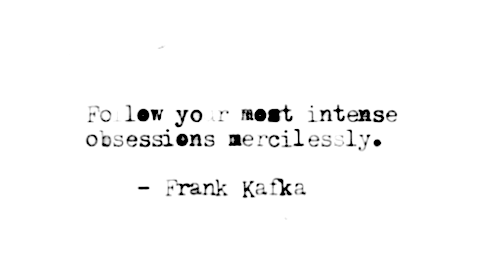 Black and white typewritten quote about following desires.