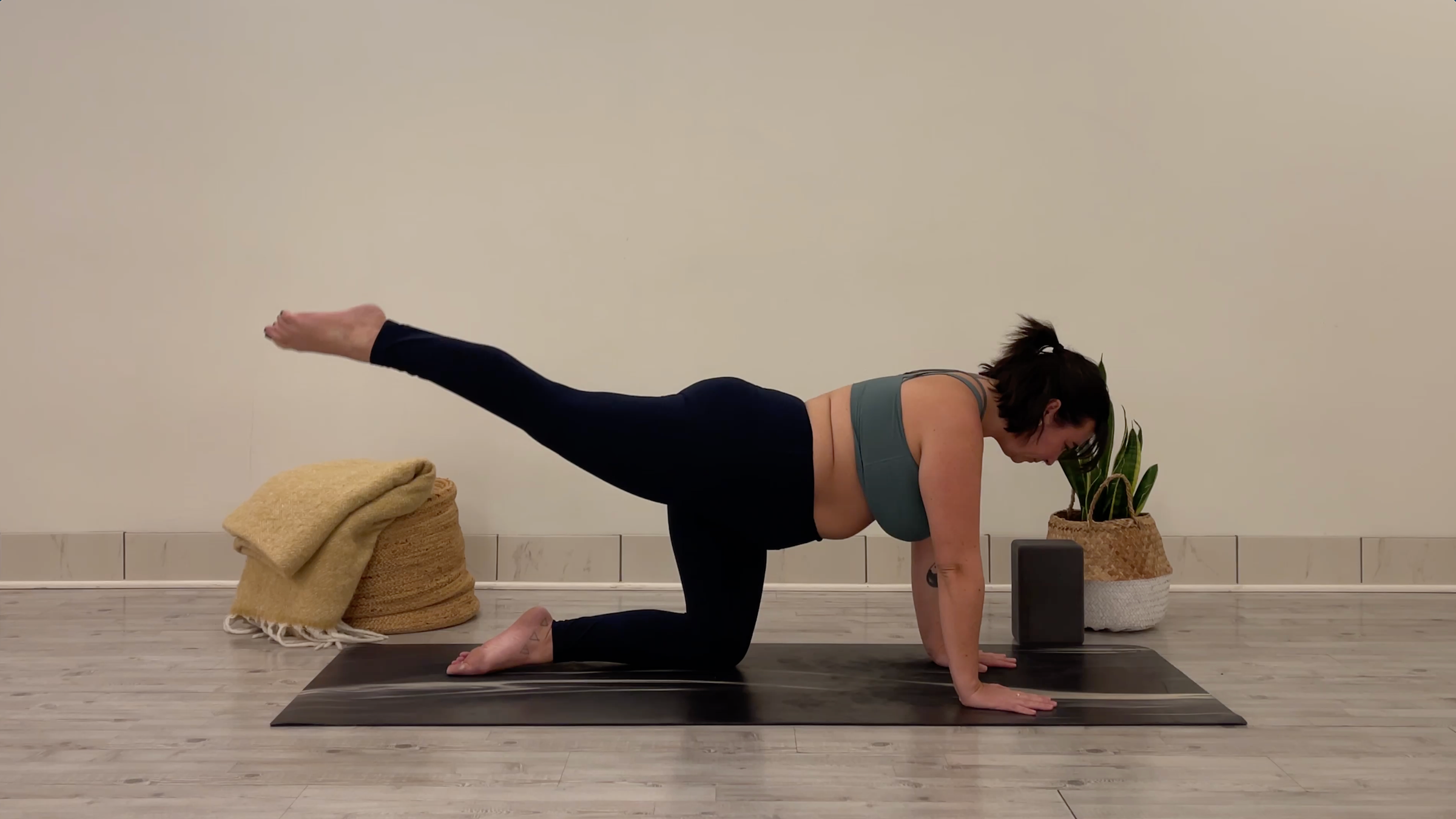 Teacher Taylor Lorenz doing Dynamic Leg Extensions