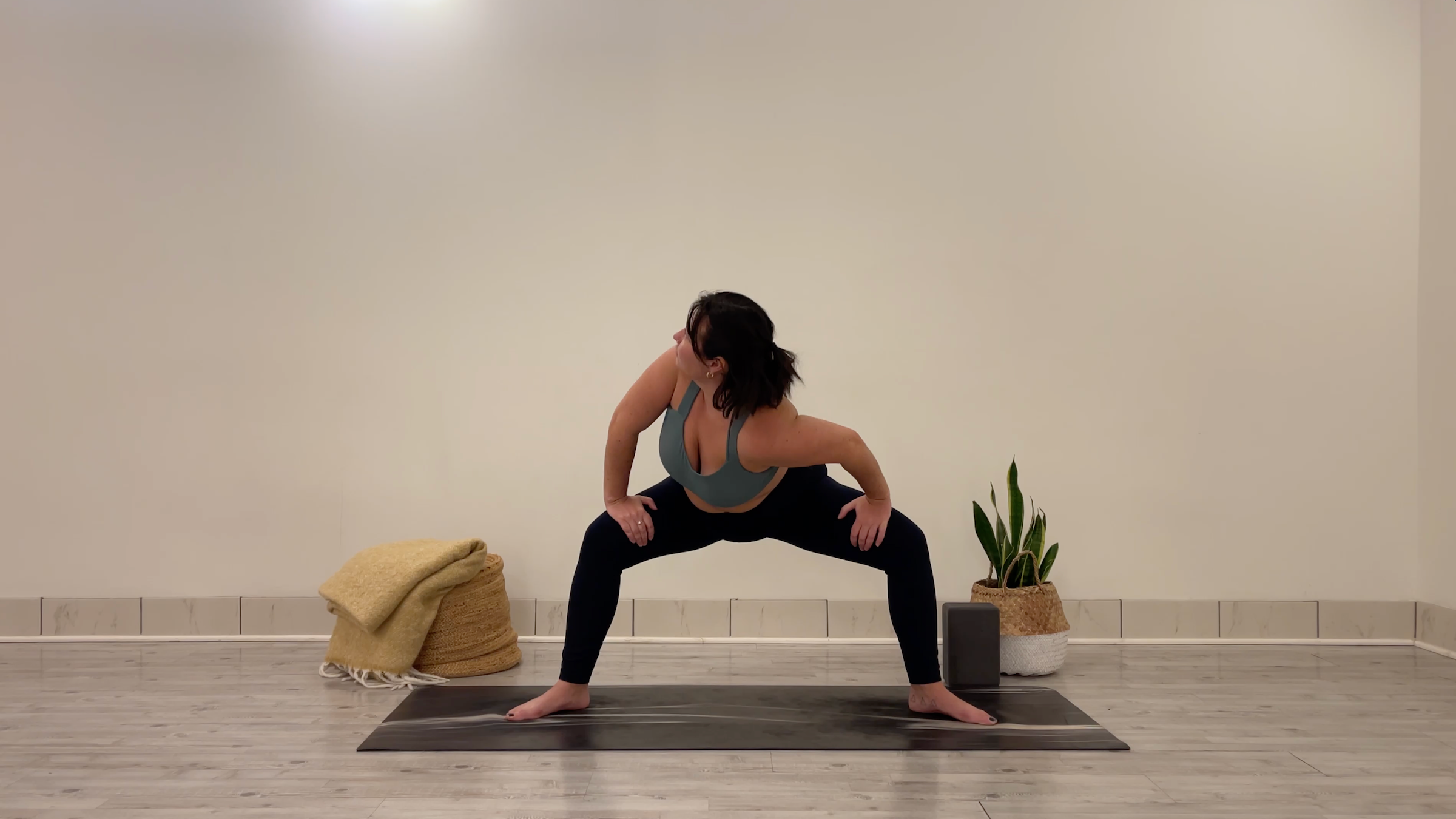 Teacher Taylor Lorenz doing Goddess Shoulder Dips