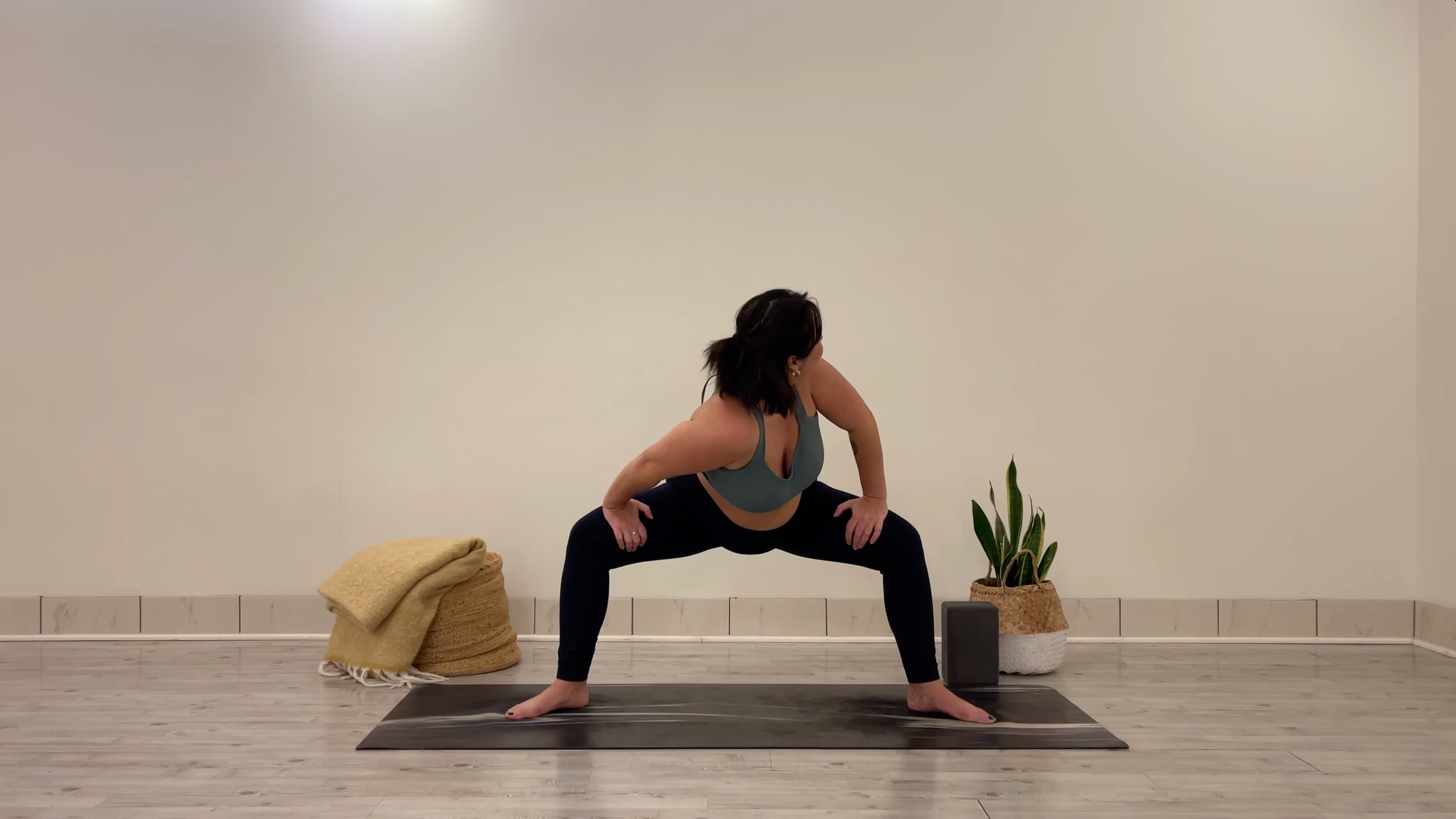 Teacher Taylor Lorenz doing Goddess Shoulder Dips