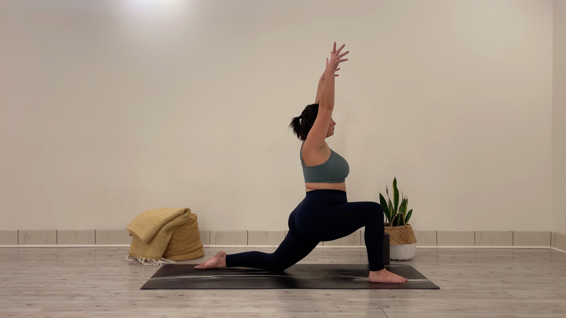 Yoga teacher Taylor Lorenz in Low Lunge, part of her yoga practice to beat the winter blues