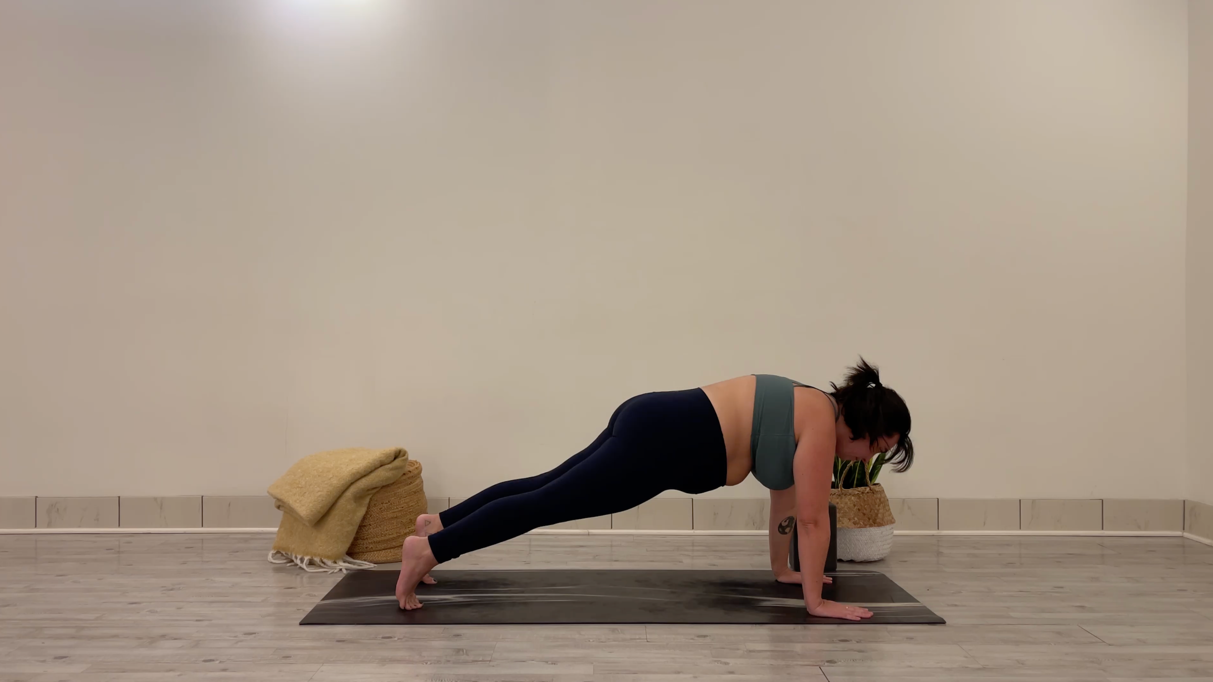 Teacher Taylor Lorenz in Plank Pose