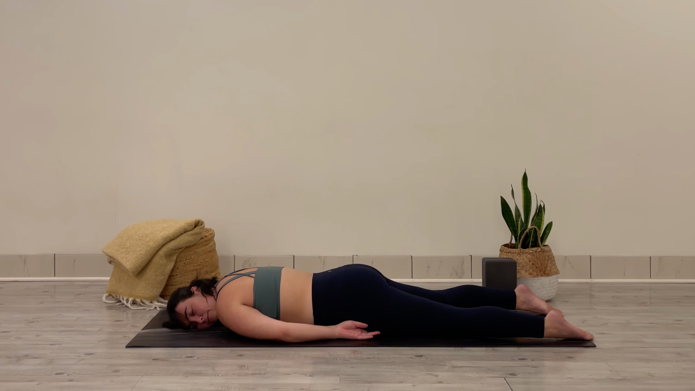 Yoga teacher Taylor Lorenz in Reverse Savasana, part of her yoga practice to beat the winter blues