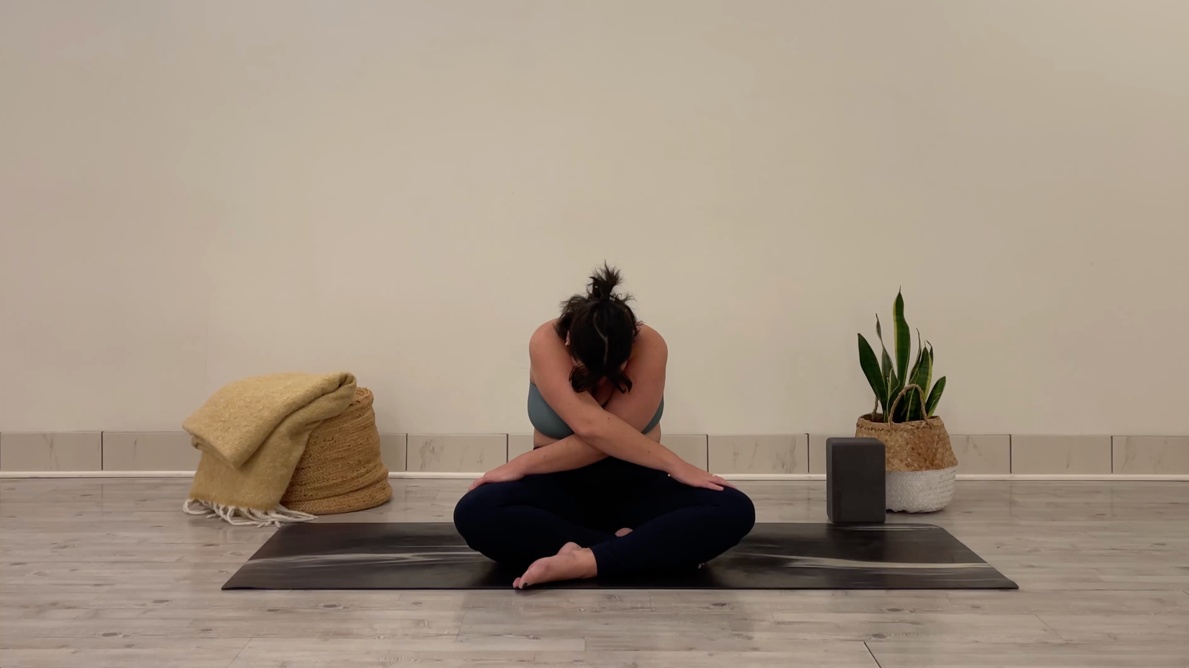 Teacher Taylor Lorenz in Seated Forward Bend