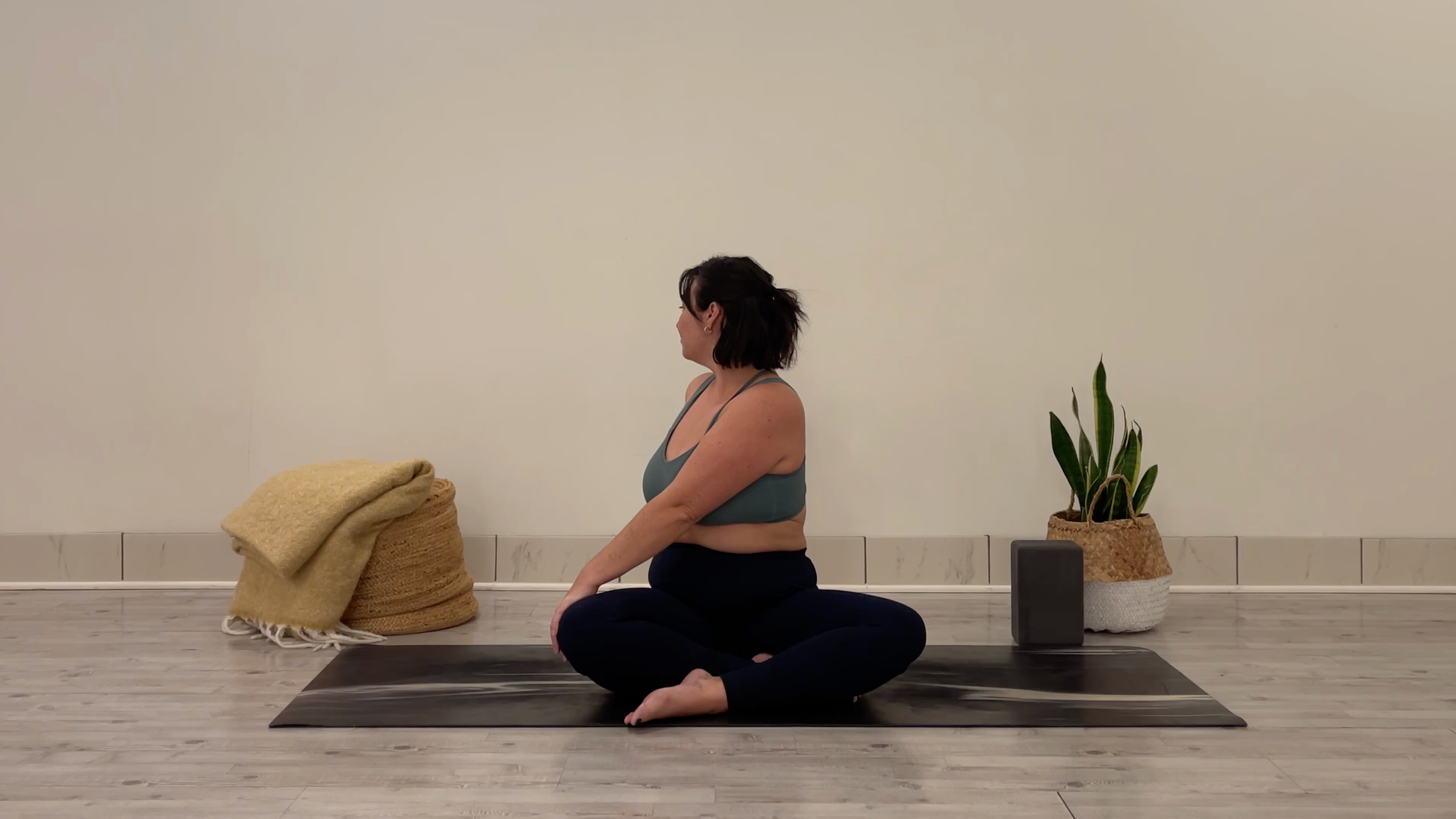 Teacher Taylor Lorenz in Seated Twist