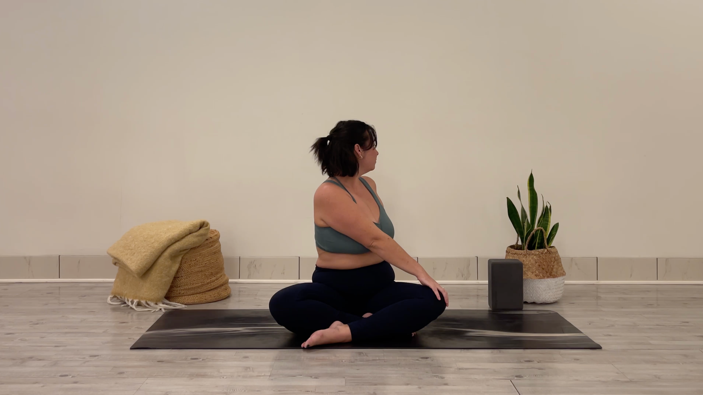 Teacher Taylor Lorenz in Seated Twist