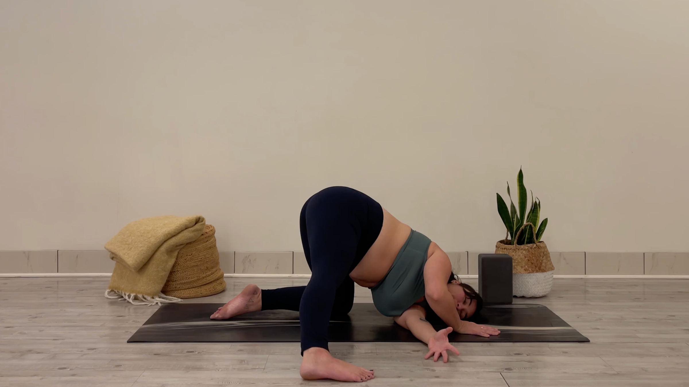 Yoga teacher Taylor Lorenz in Thread the Needle, part of her yoga practice to beat the winter blues