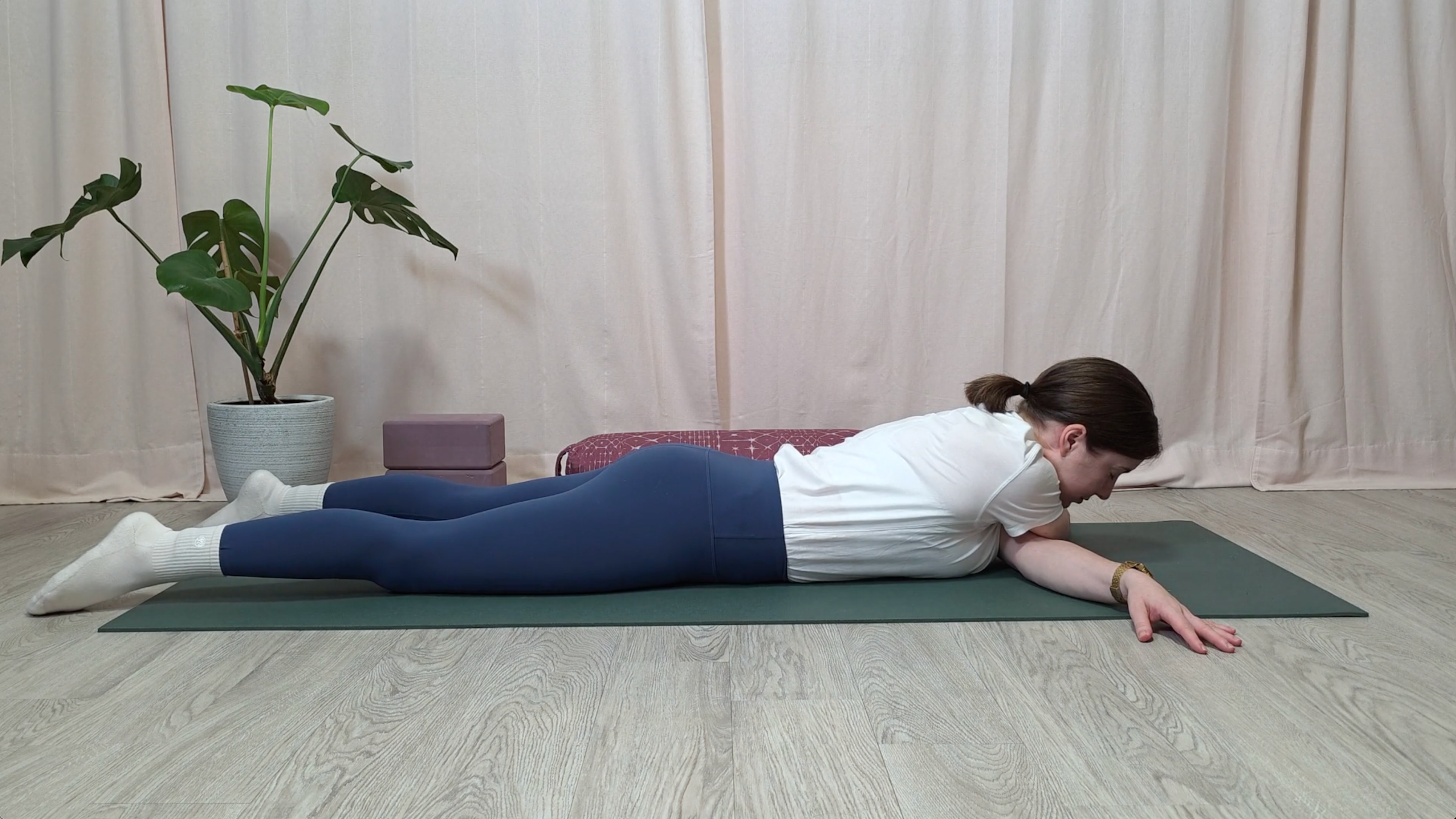 Yoga teacher Katie McGrath in Bow Tie Pose, part of her yin yoga for shoulders practice