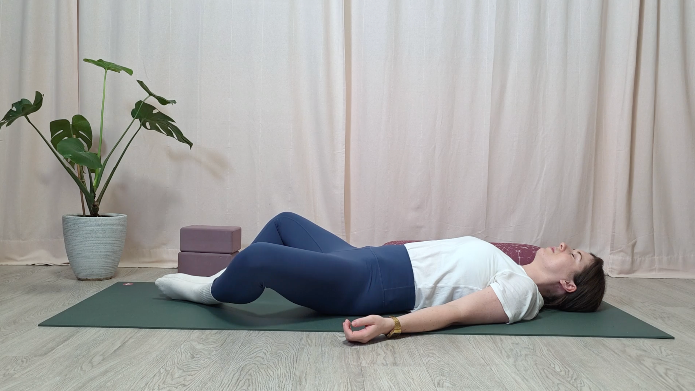 Yoga teacher Katie McGrath in Reclined Butterfly, part of her yin yoga for stress practice