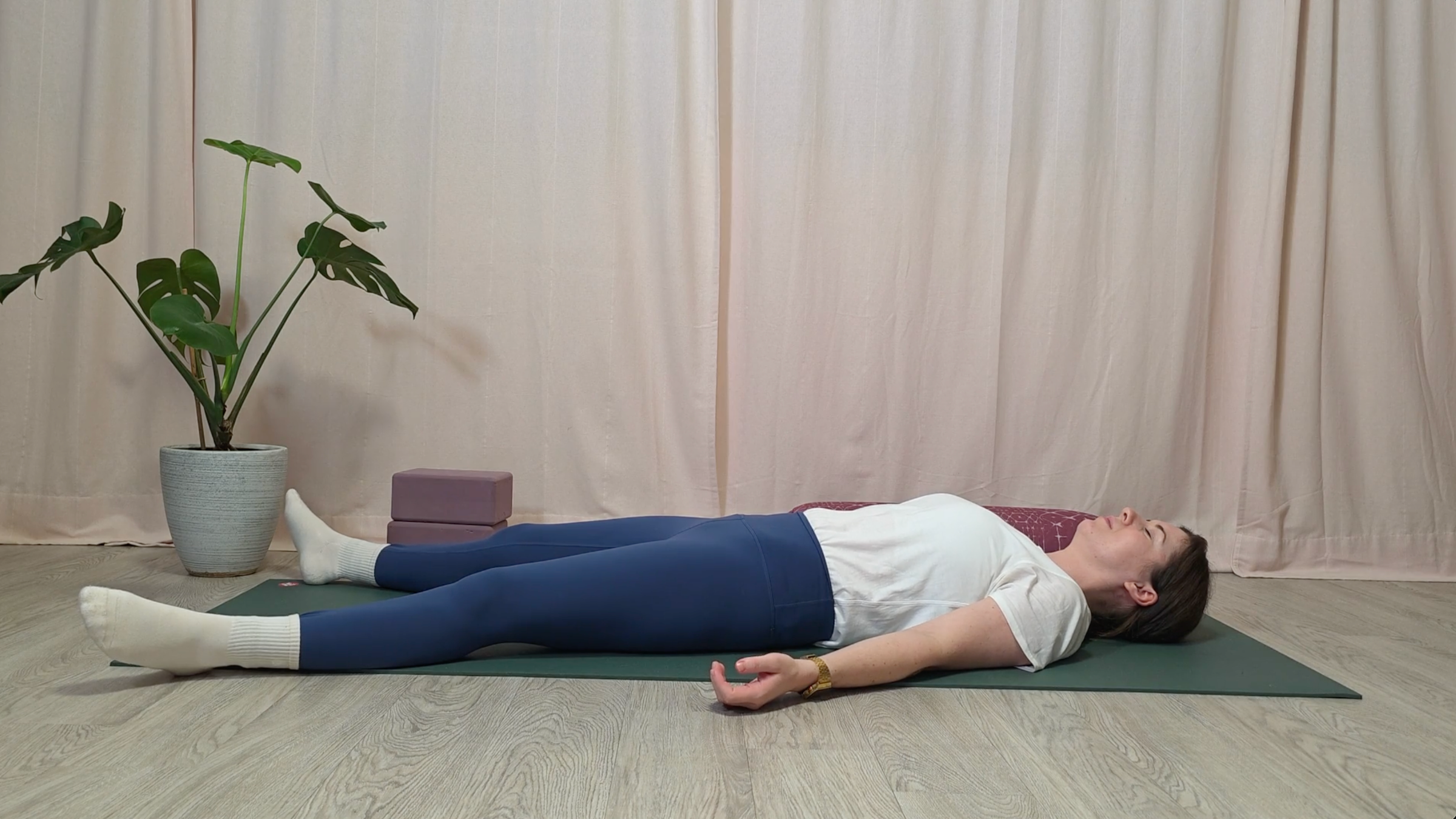 Teacher Katie McGrath in Savasana