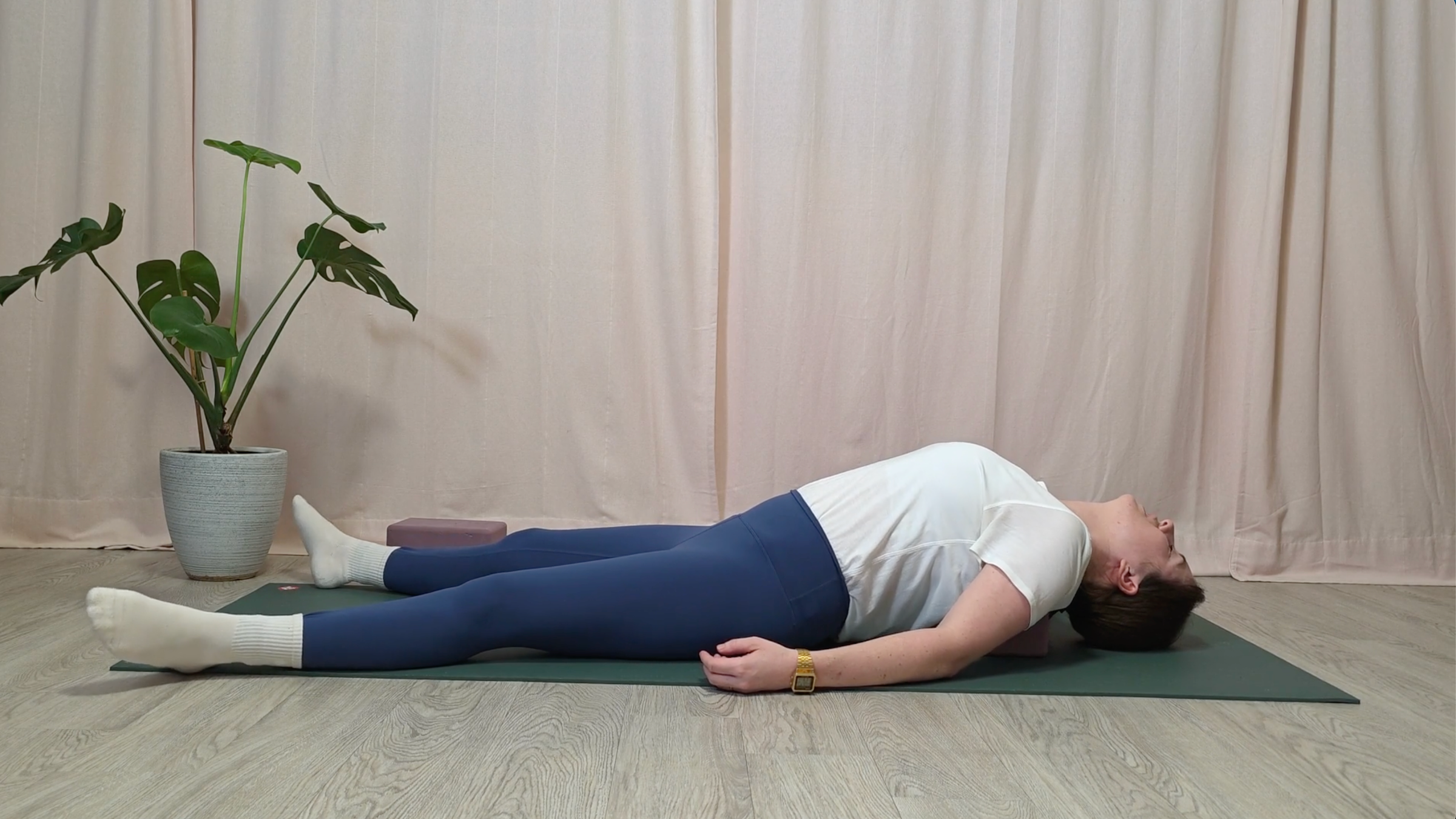 Yoga teacher Katie McGrath in Supported Fish Pose, part of her yin yoga for stress practice