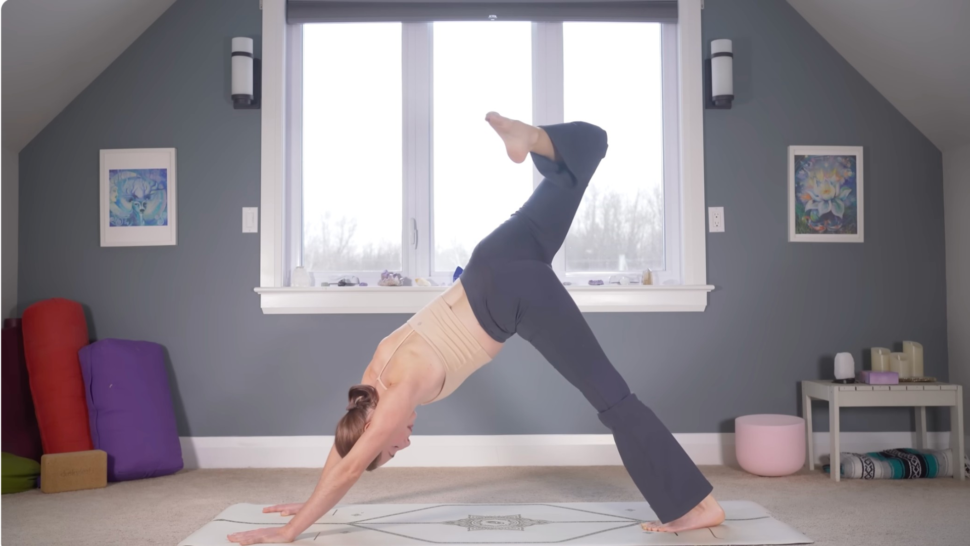 Woman in Downward-Facing Dog and lifting one leg