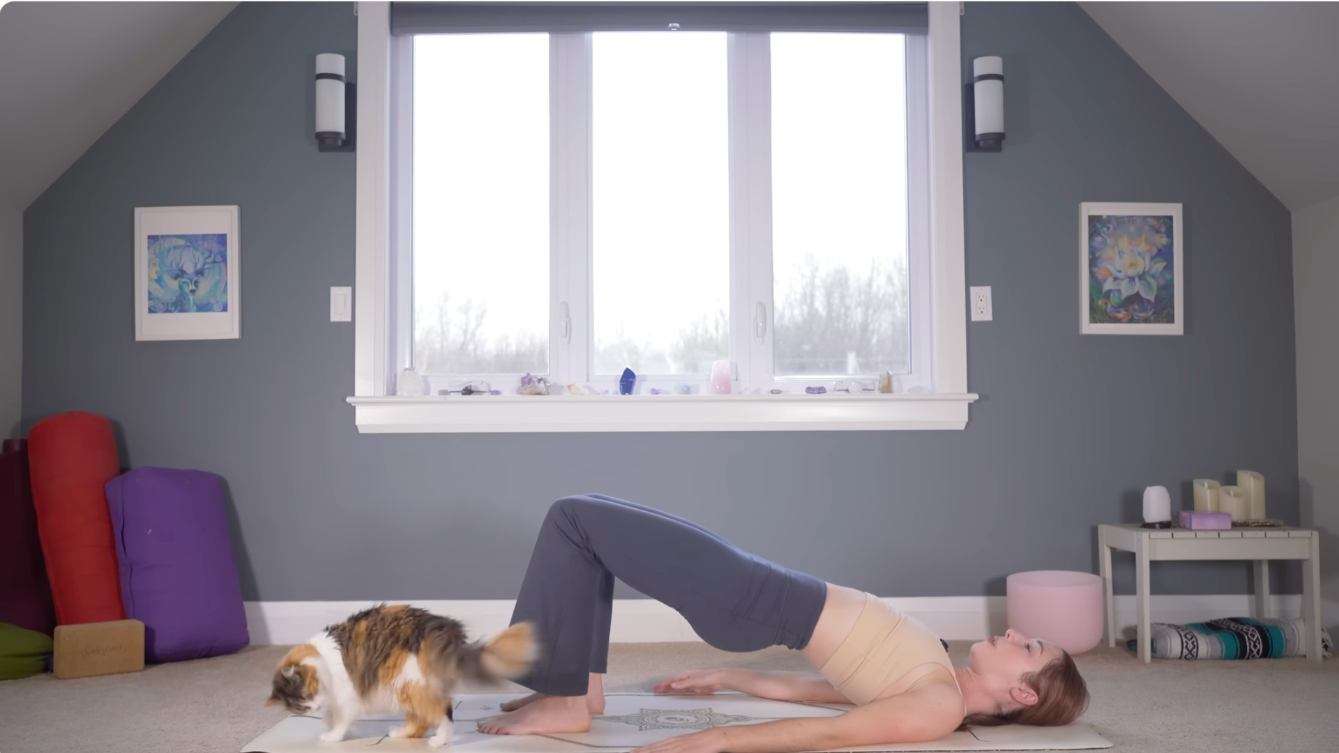 Woman lying on a mat in Bridge Pose with her hips lifted