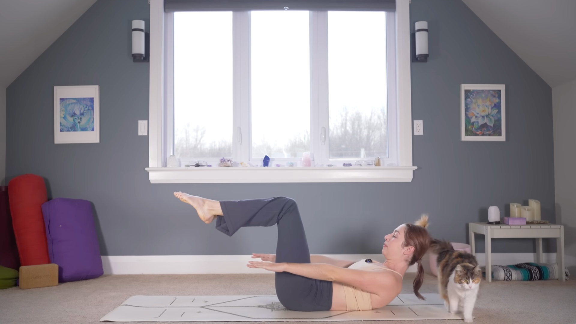 Woman lying on her back with her knees bent and stacked above her hips