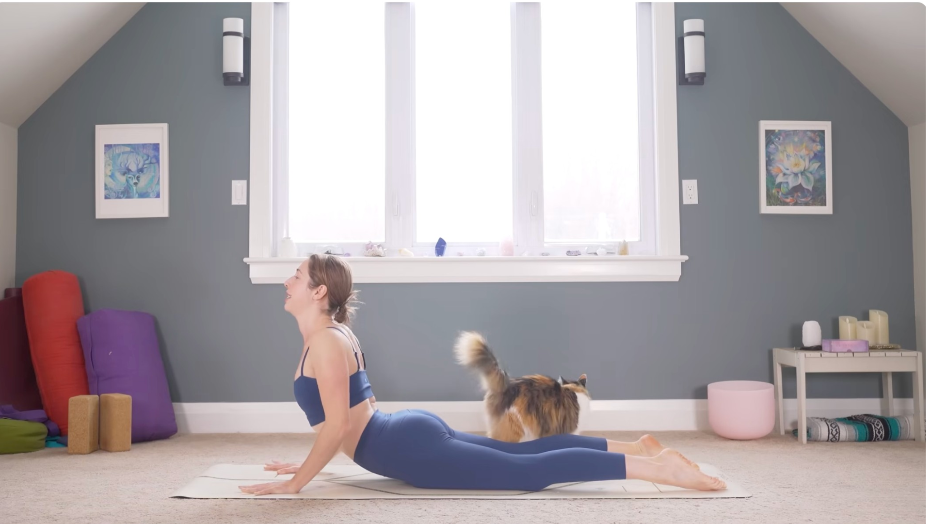 Woman lying on her belly and palms pressing into the mat