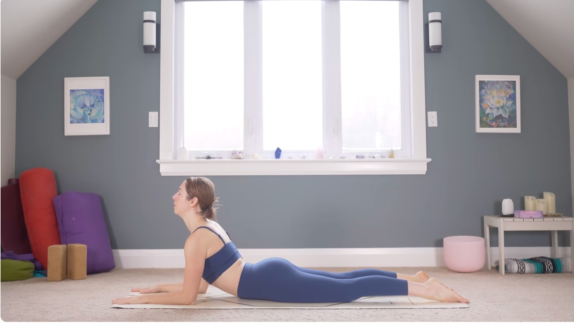 Woman on her belly on a yoga mat lifting her chest
