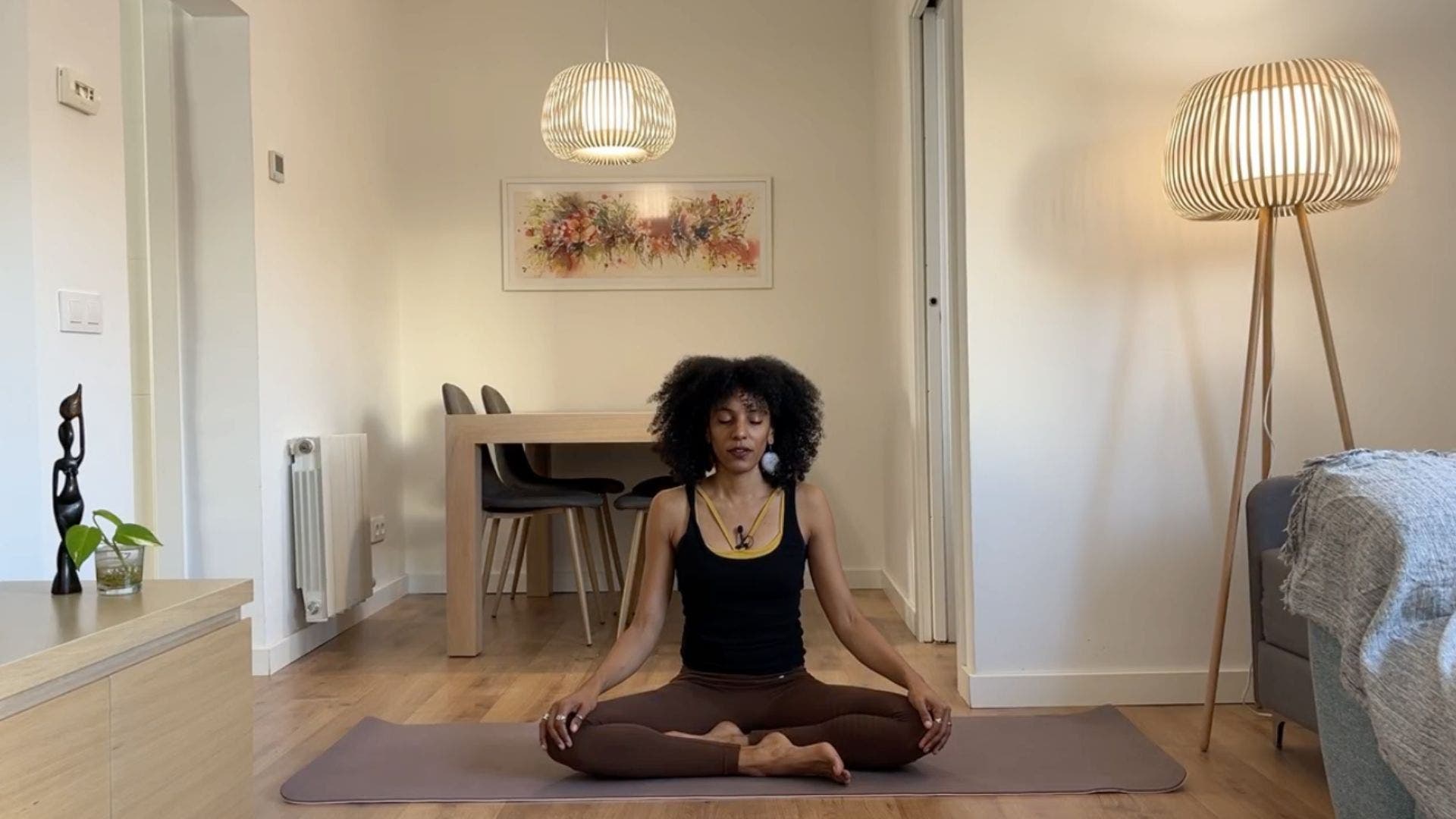 Yoga teacher practicing Easy Pose.