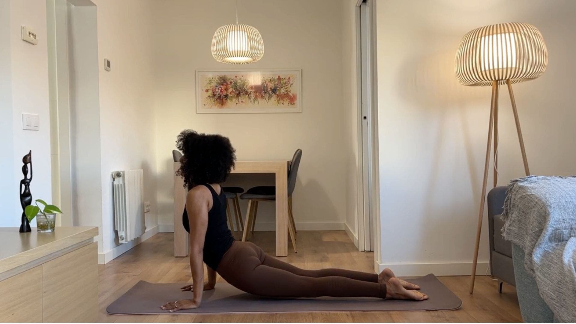 Yoga teacher practicing Upward Dog.