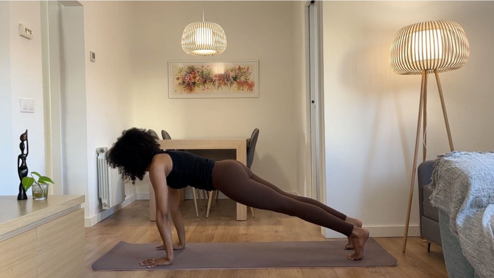 Yoga teacher practicing Plank.