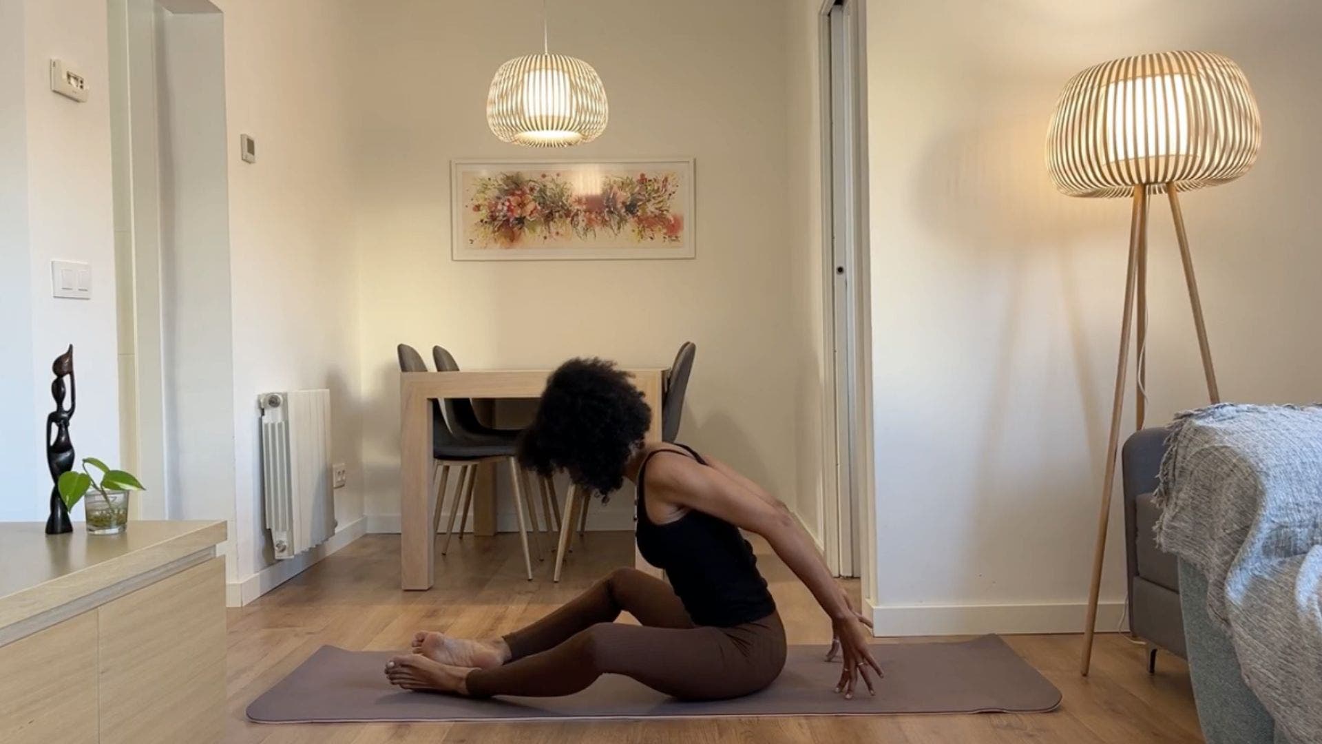 Yoga teacher practicing Bound Angle Pose.