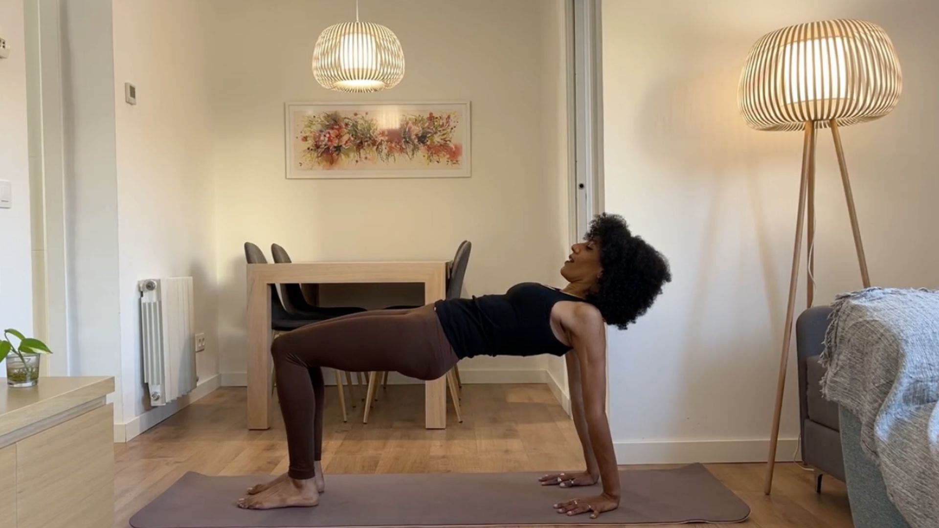 Yoga teacher practicing Reverse Tabletop.