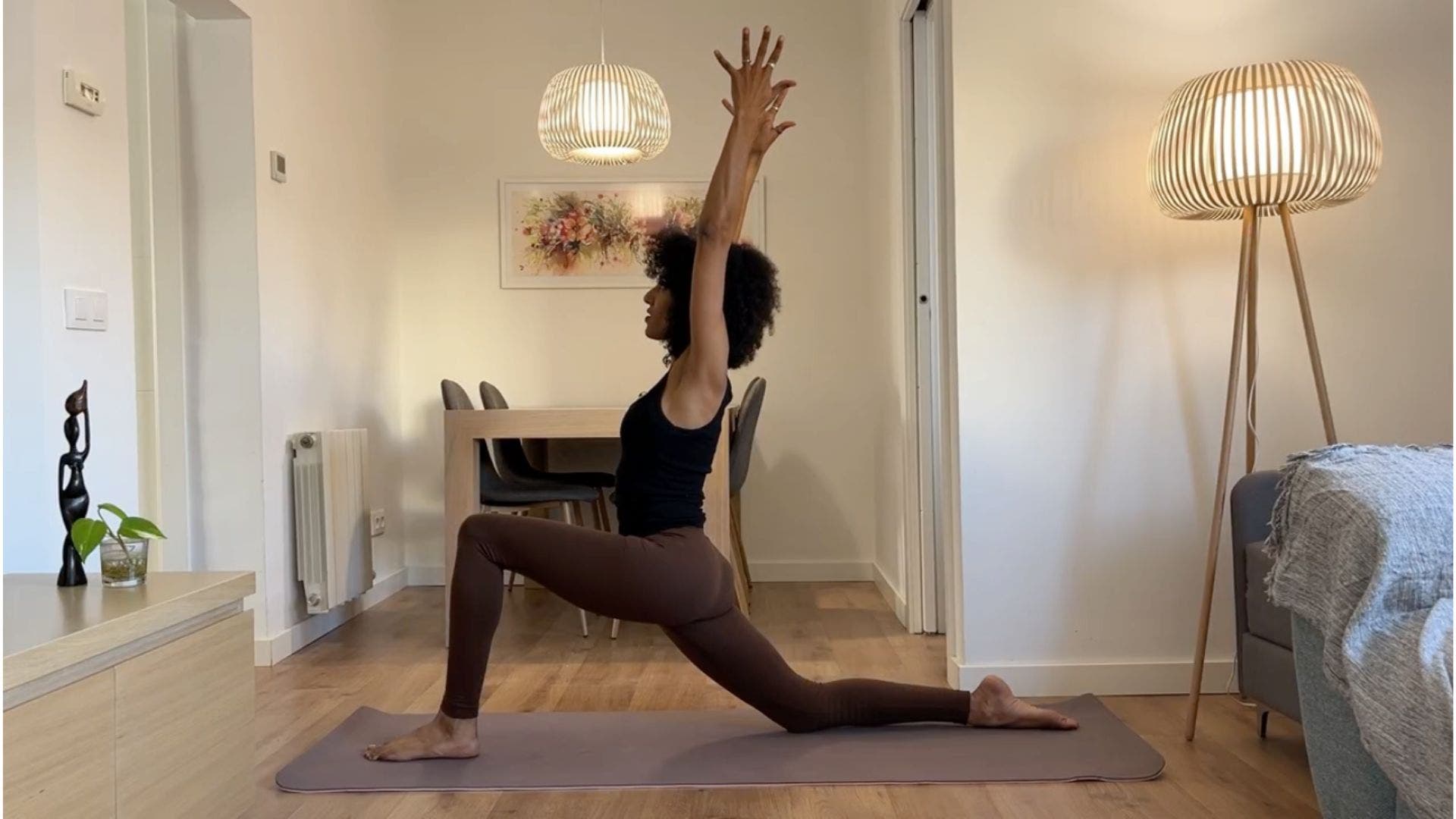 Yoga teacher practicing Low Lunge.
