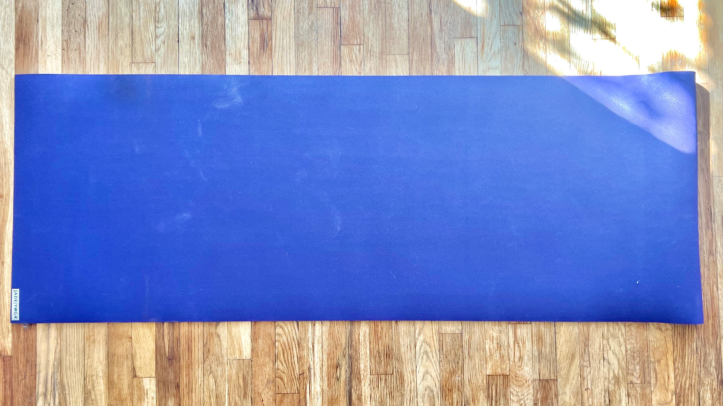 Tester image of blue Jade yoga mat showing aerial shot of yoga mat