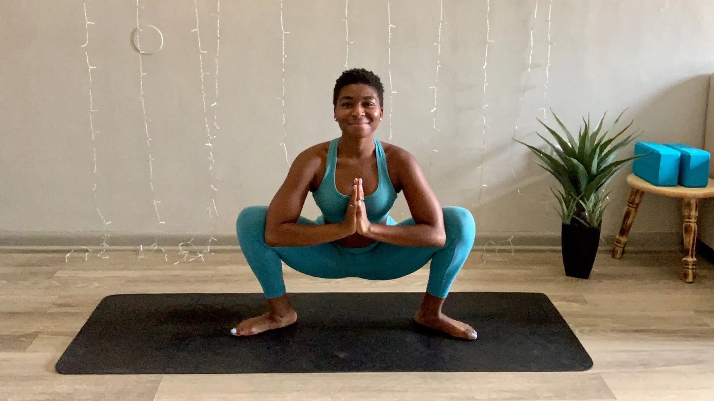 Yoga teacher Charnette Batey in Malasana