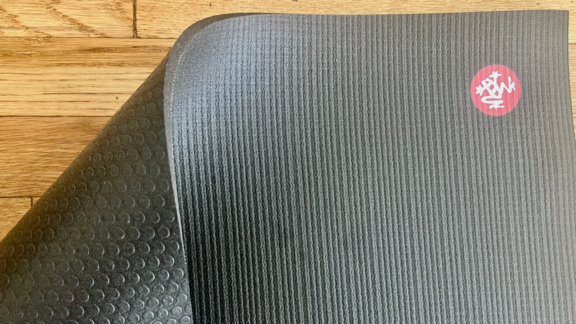 Manduka Yoga Map flipped to show top and bottom high grip fabric