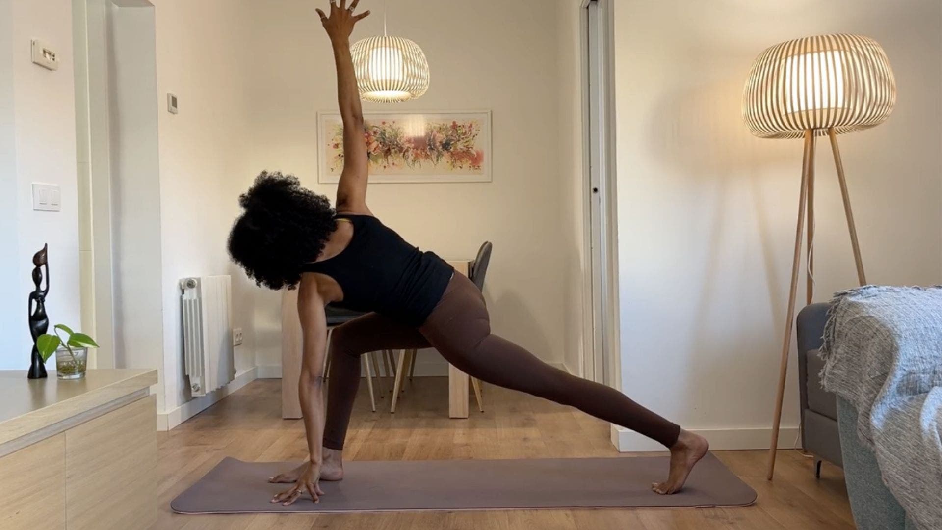 Yoga teacher practicing revolved Lunge.
