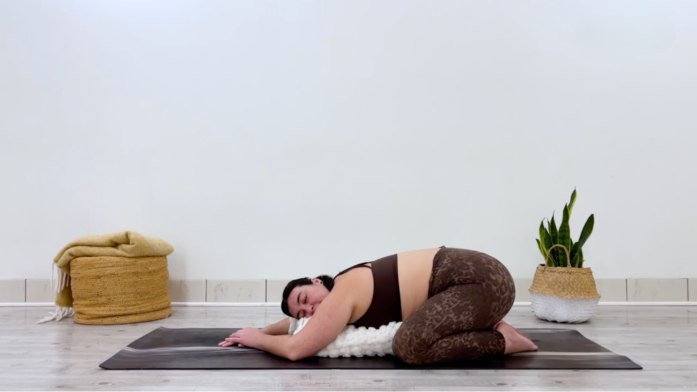 Teacher Taylor Lorenz in Child's Pose