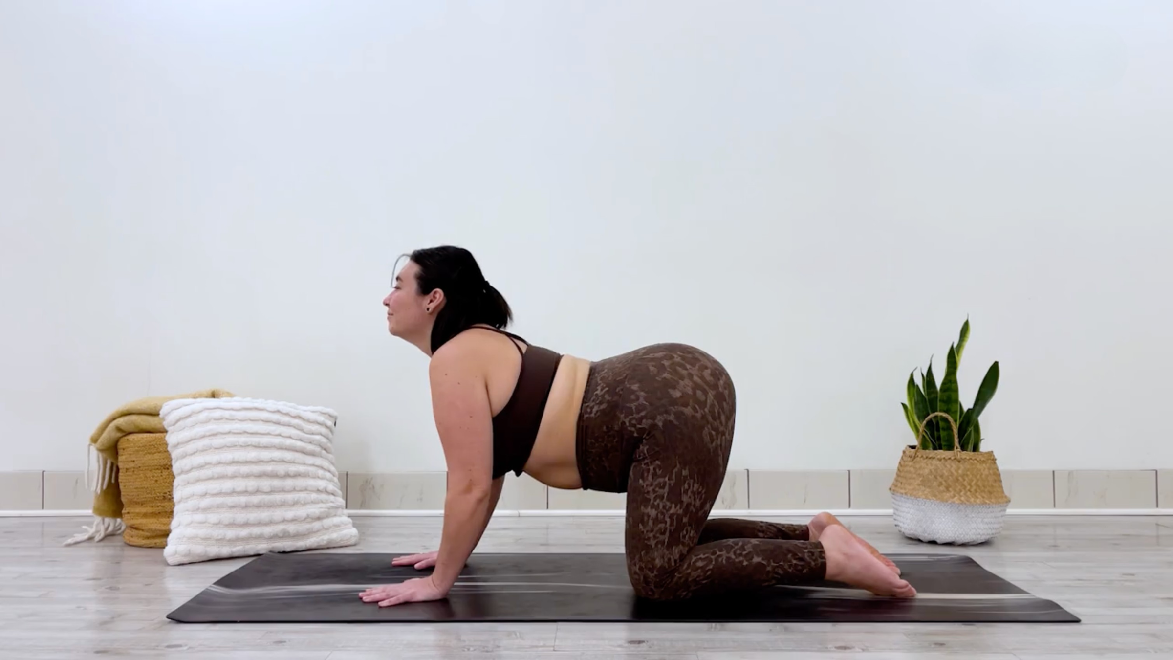 Yoga teacher Taylor Lorenz in Cow Pose, part of her bedtime yoga practice