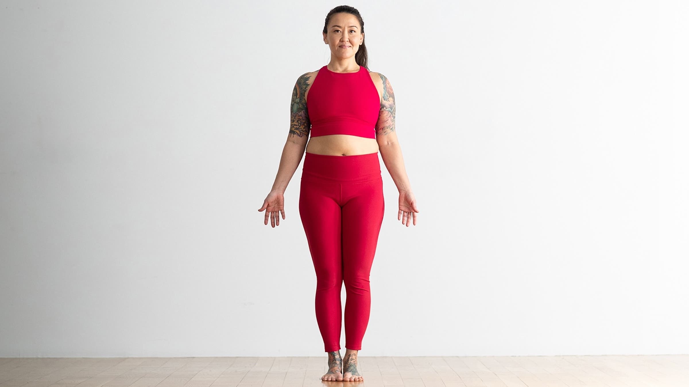 A yoga teacher in Mountain Pose