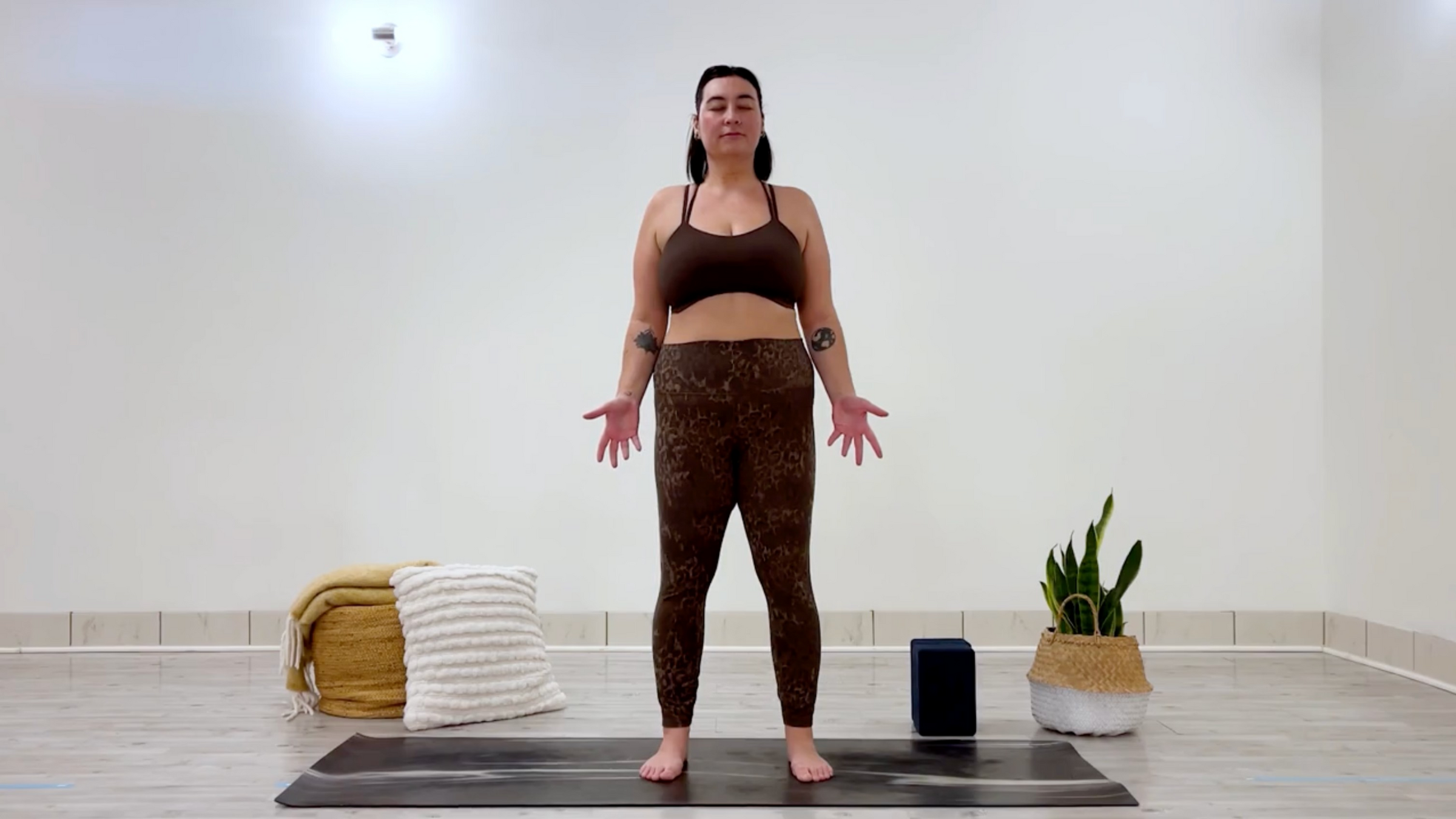 Yoga teacher Taylor Lorenz in Mountain Pose, part of her self-love yoga practice