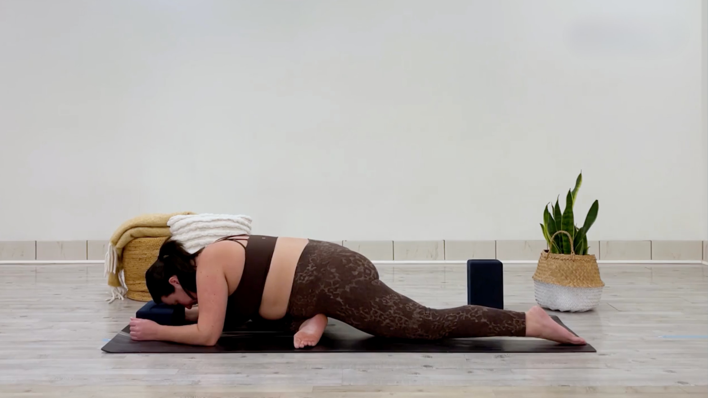 Yoga teacher Taylor Lorenz in Pigeon Pose, part of her self-love yoga practice