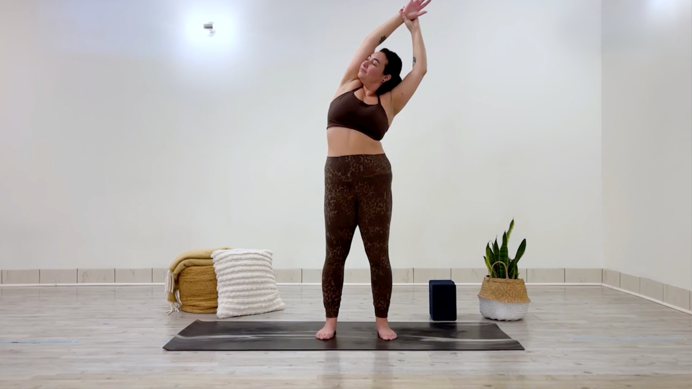 Yoga teacher Taylor Lorenz in Standing Side Bend, part of her self-love yoga practice
